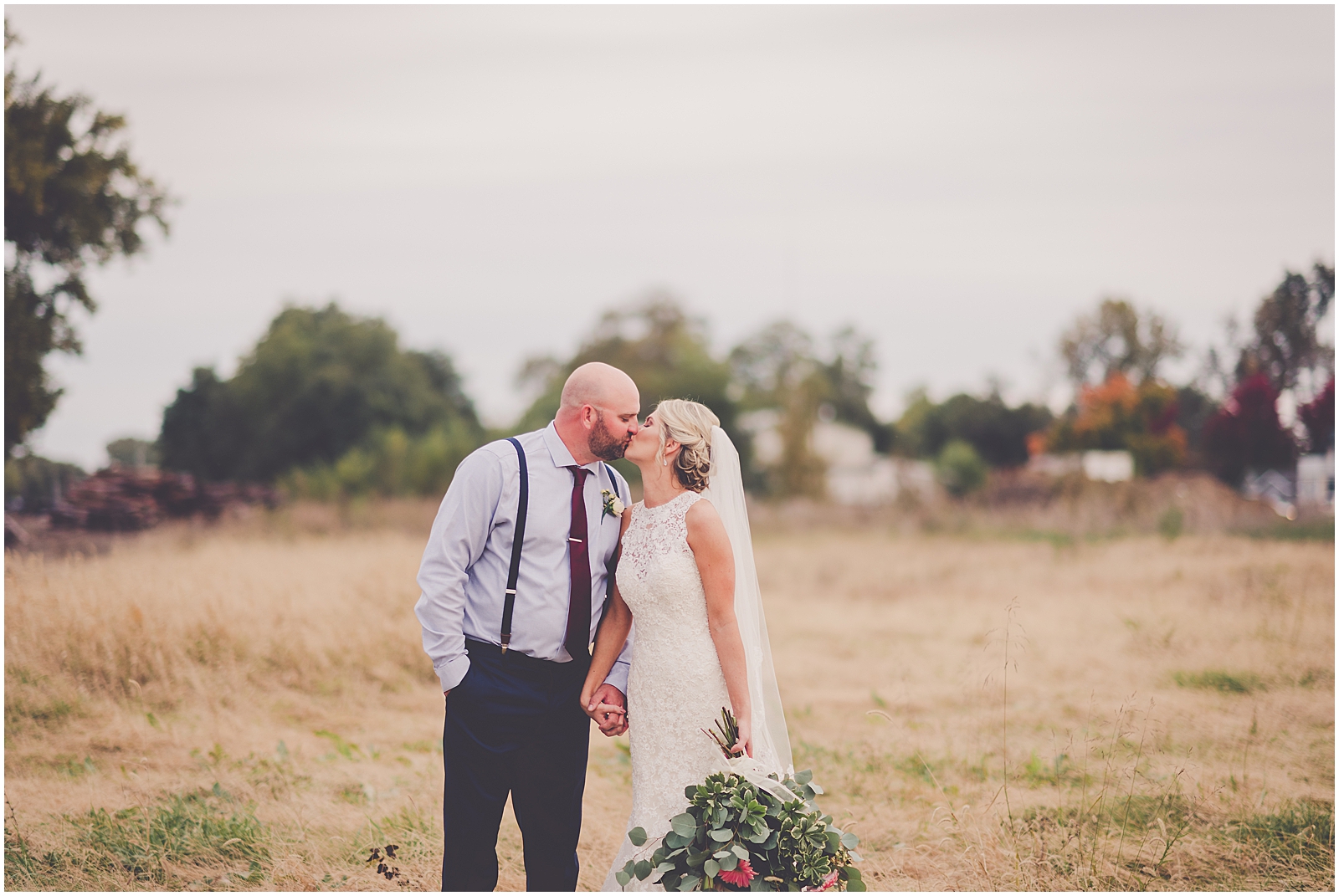 Cari and Nick's rustic fall cabernet and navy Round House Event Center wedding day in Beardstown, IL with Chicagoland wedding photographer Kara Evans Photographer.