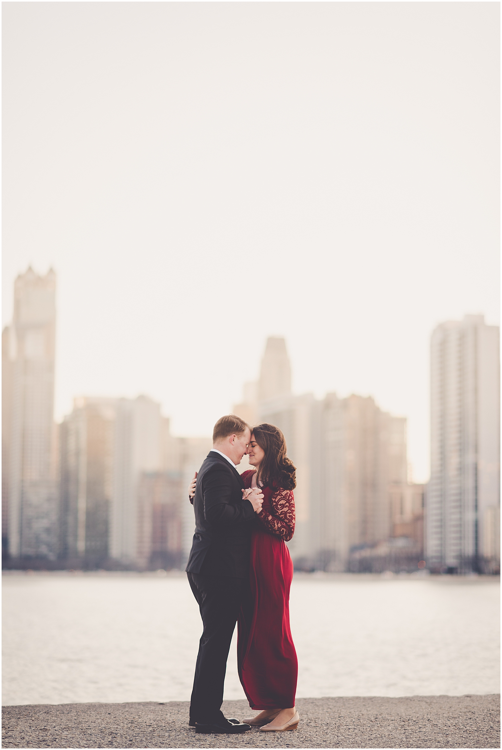 Kim and Josh's December Chicago skyline engagement session at North Avenue Beach in Chicago, IL with Chicagoland wedding photographer Kara Evans Photographer.