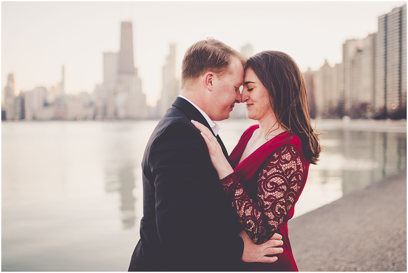 Kim and Josh's December Chicago skyline engagement session at North Avenue Beach in Chicago, IL with Chicagoland wedding photographer Kara Evans Photographer.