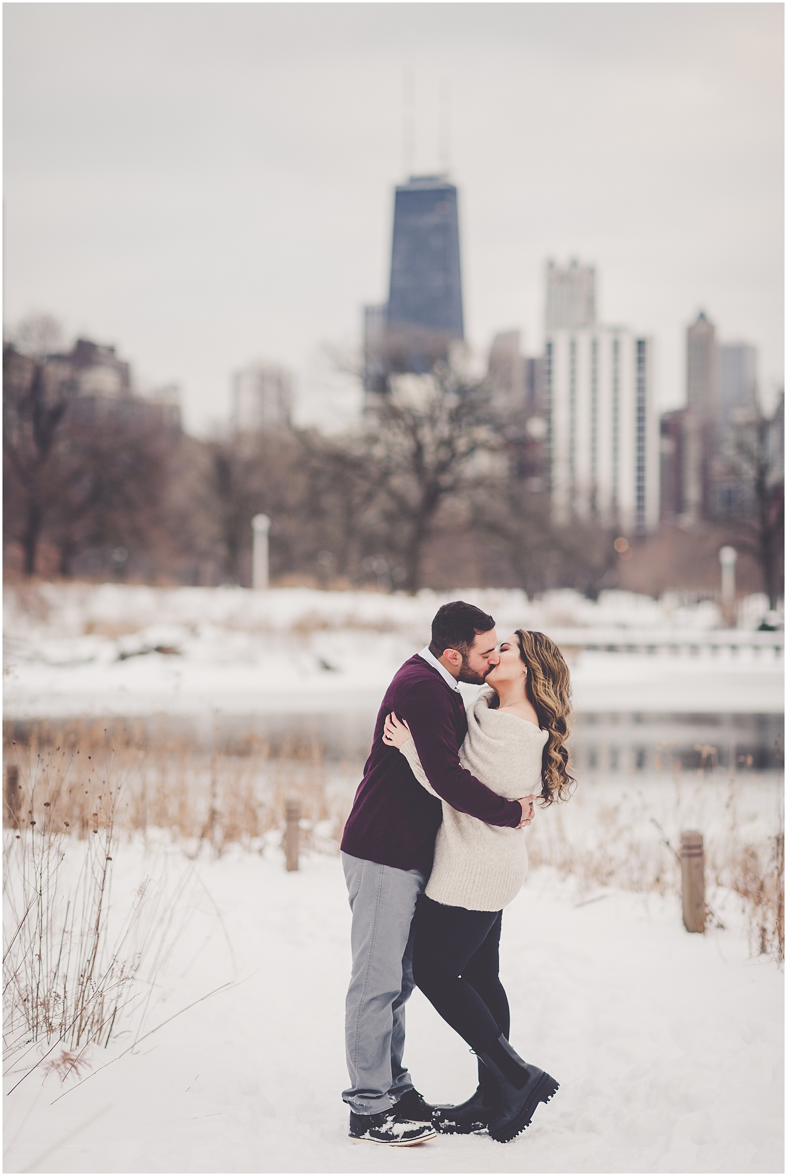 Dina and Adonis' snowy winter Lincoln Park engagement photos in Chicago with Chicagoland wedding photographer Kara Evans Photographer.