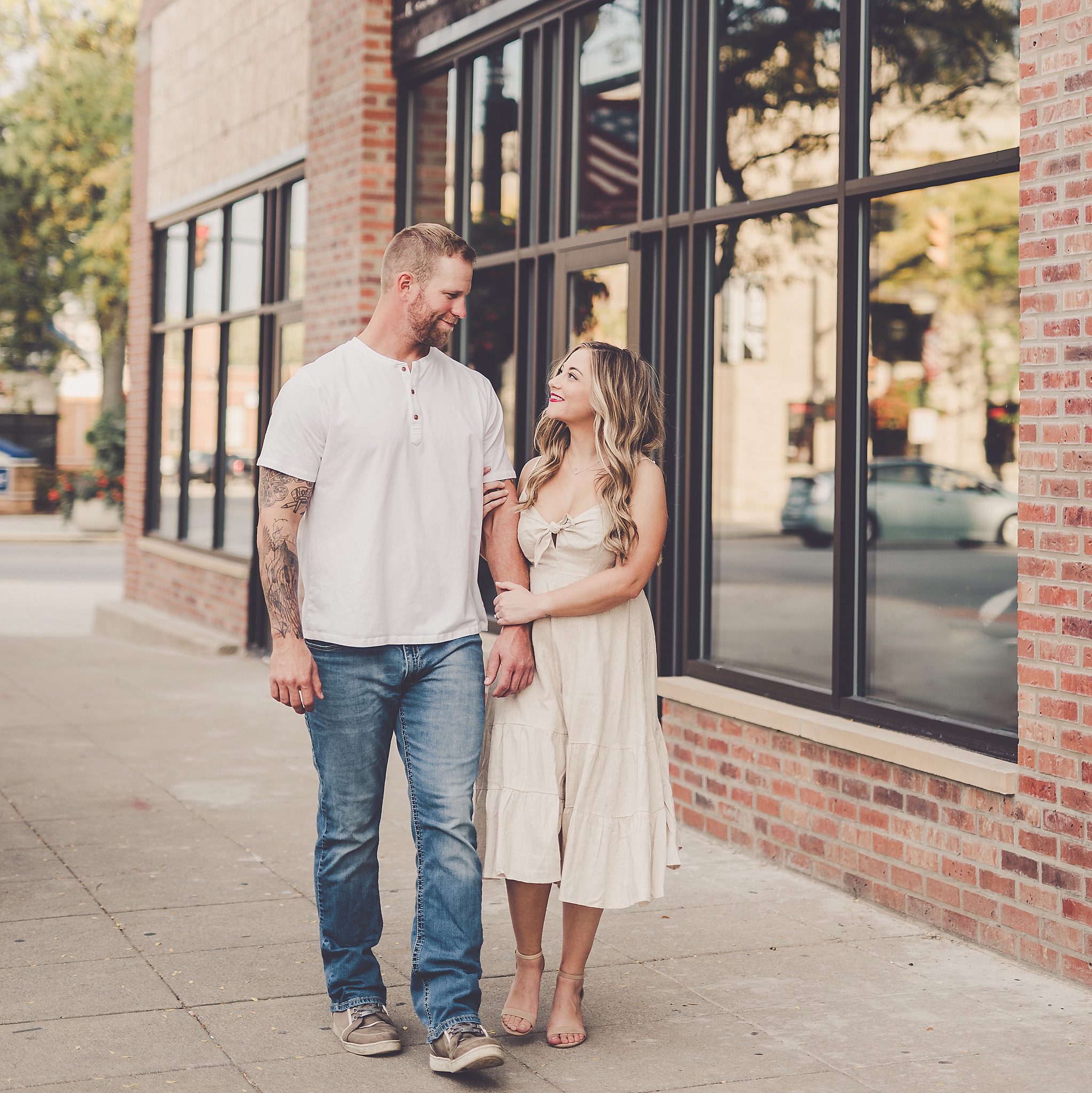 Bre and Sean's fall downtown Crown Point engagement in Crown Point, IN with Chicagoland wedding photographer Kara Evans Photographer.