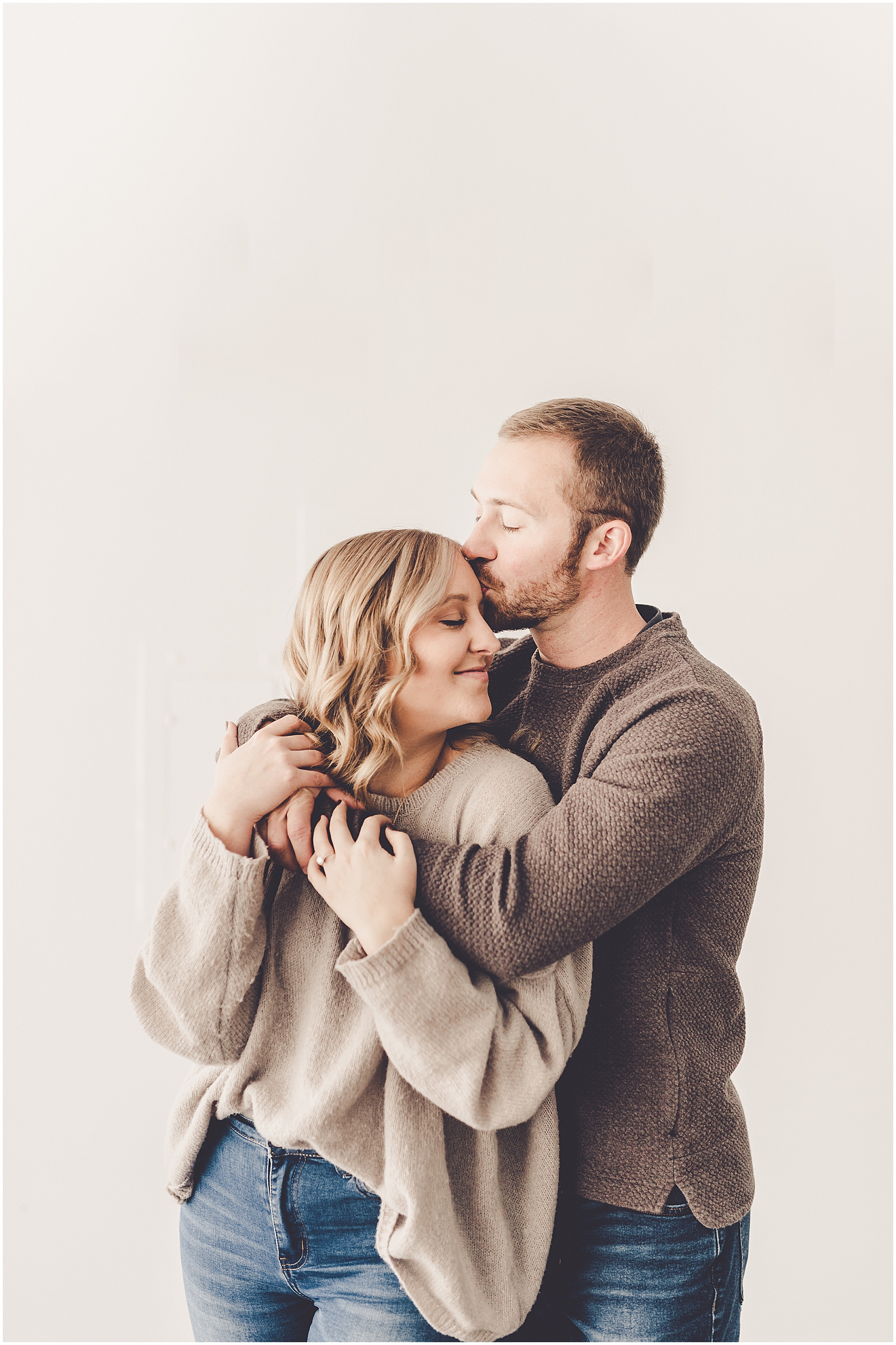 Abby and Max's studio and tree farm engagement photos in Kankakee, Illinois with Chicagoland wedding photographer Kara Evans Photographer.