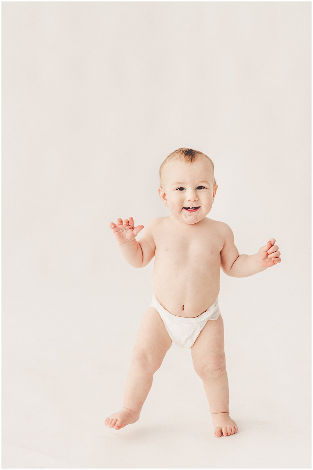 Studio one-year milestone photographer in Downtown Kankakee with Kankakee family photographer Kara Evans Photographer.