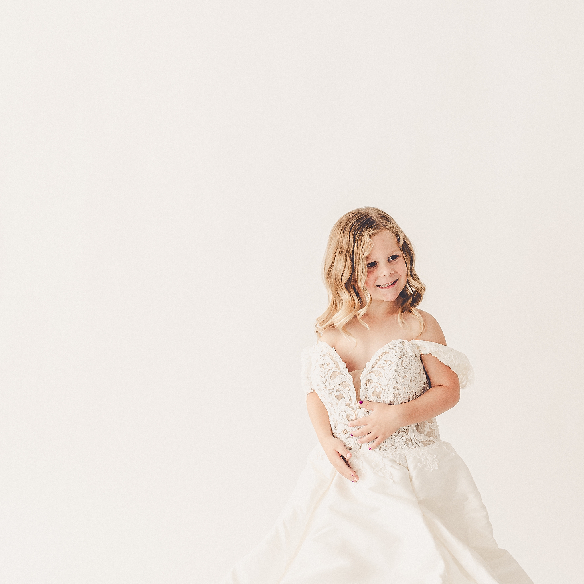 Studio milestone photos in mama's wedding dress – daughter and wedding dress photoshoot at Studio 388 in Kankakee, Illinois.