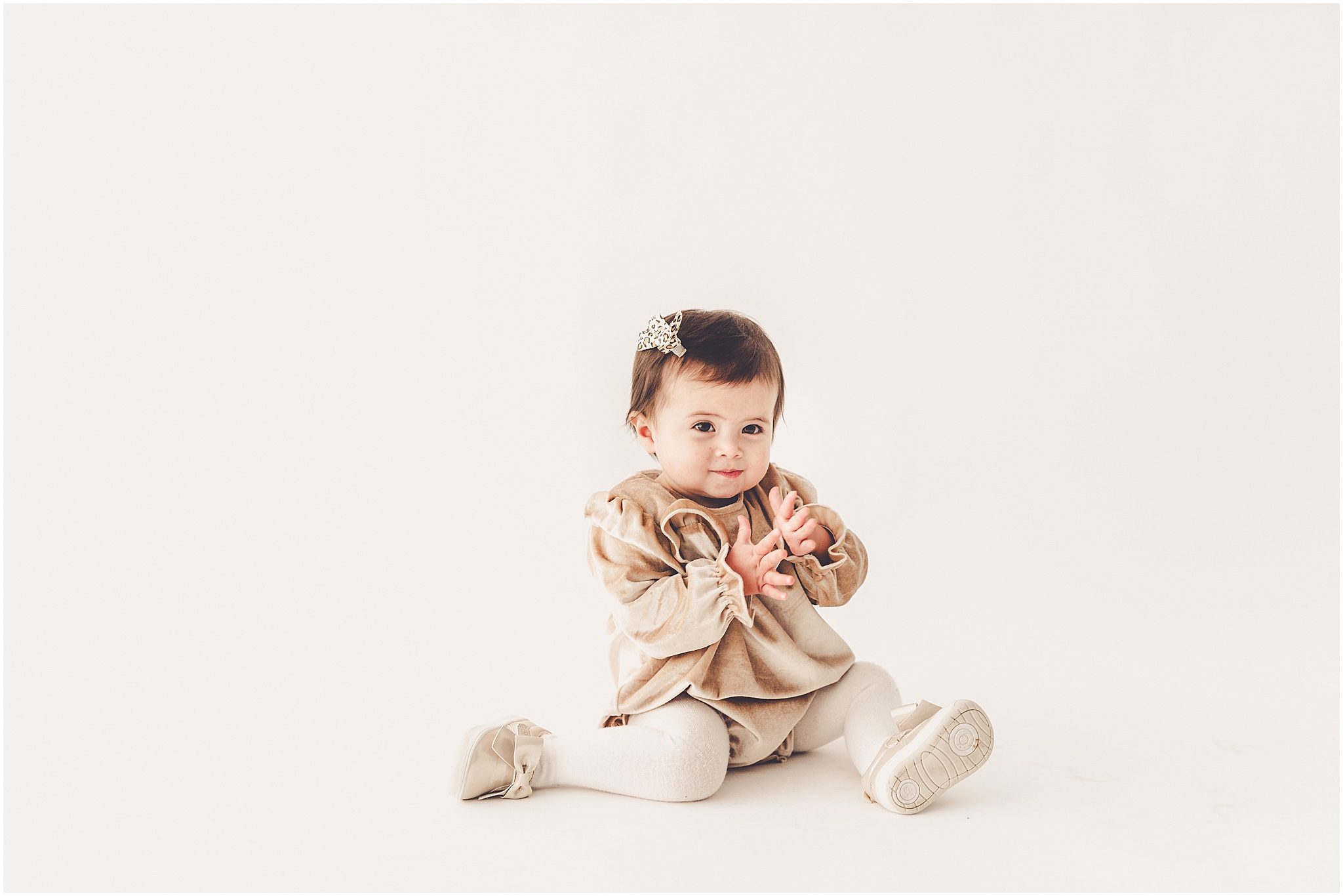 A one-year milestone session at Studio 388 in Kankakee, Illinois with Kankakee family photographer Kara Evans Photographer.