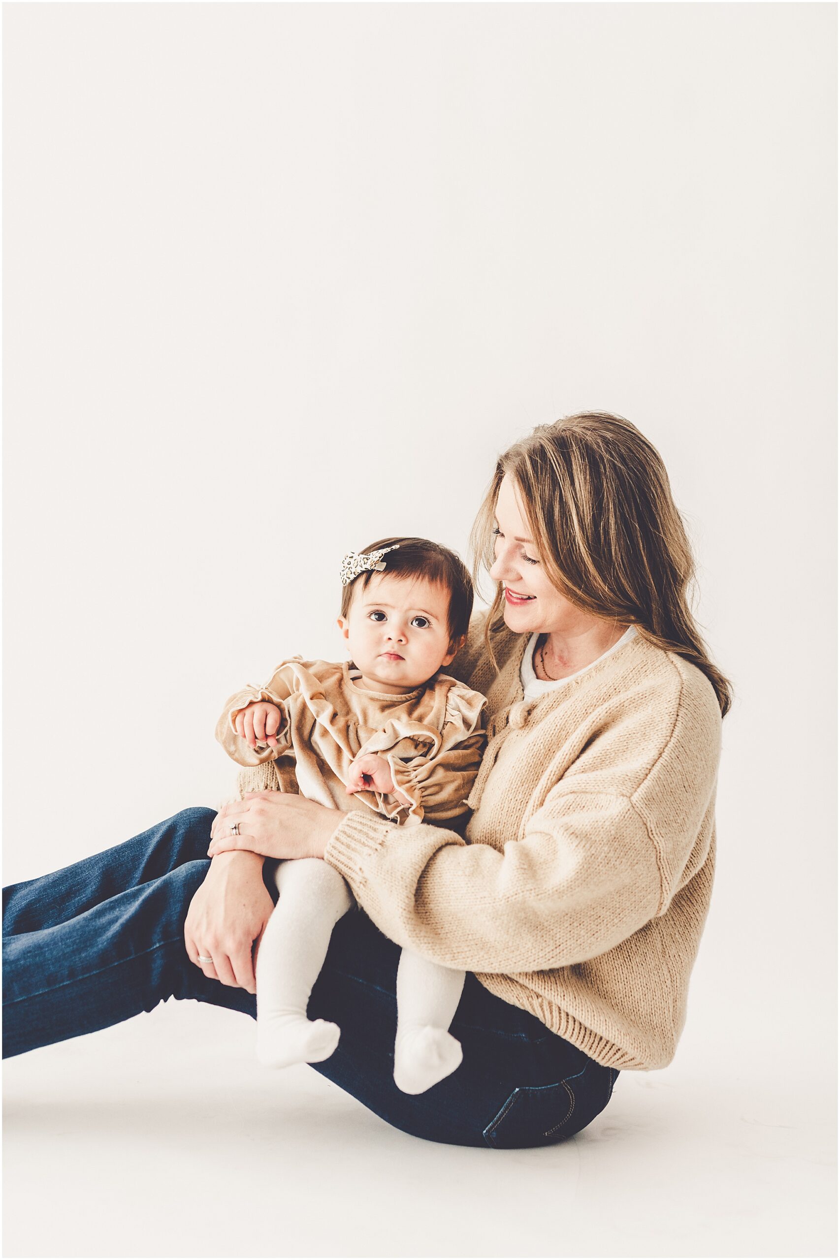 A one-year milestone session at Studio 388 in Kankakee, Illinois with Kankakee family photographer Kara Evans Photographer.