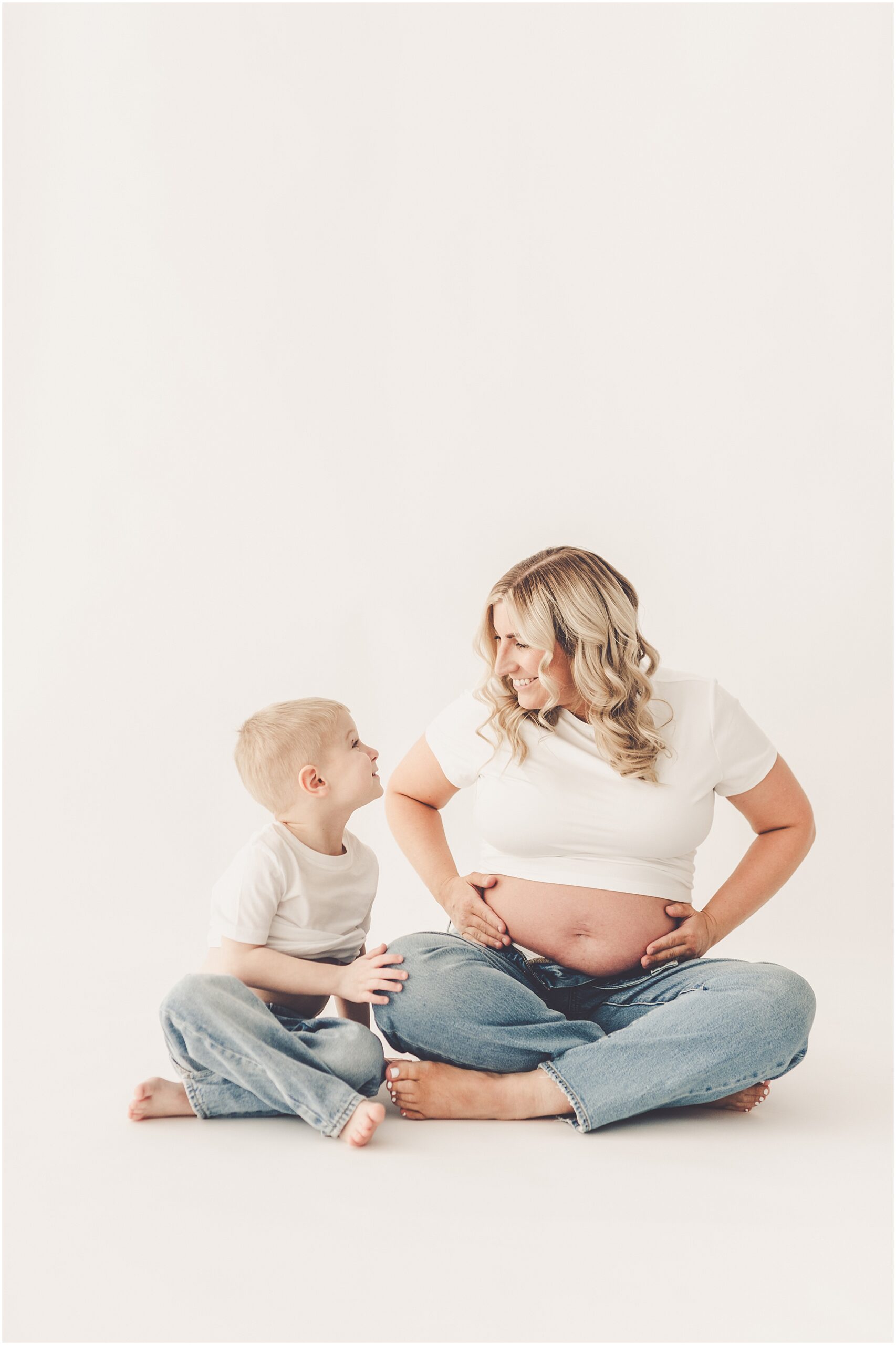 Studio maternity photographer at the Kankakee natural light photography studio with Kankakee family photographer Kara Evans Photographer.