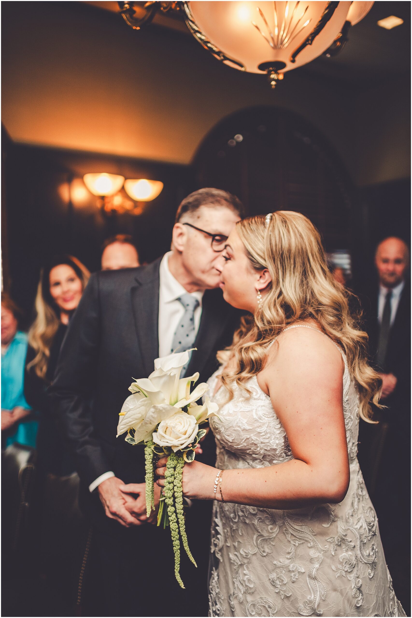 Erin and Vincent's spring wedding day at The Chicago Firehouse Restaurant in Chicago photographed by Kara Evans Photographer.