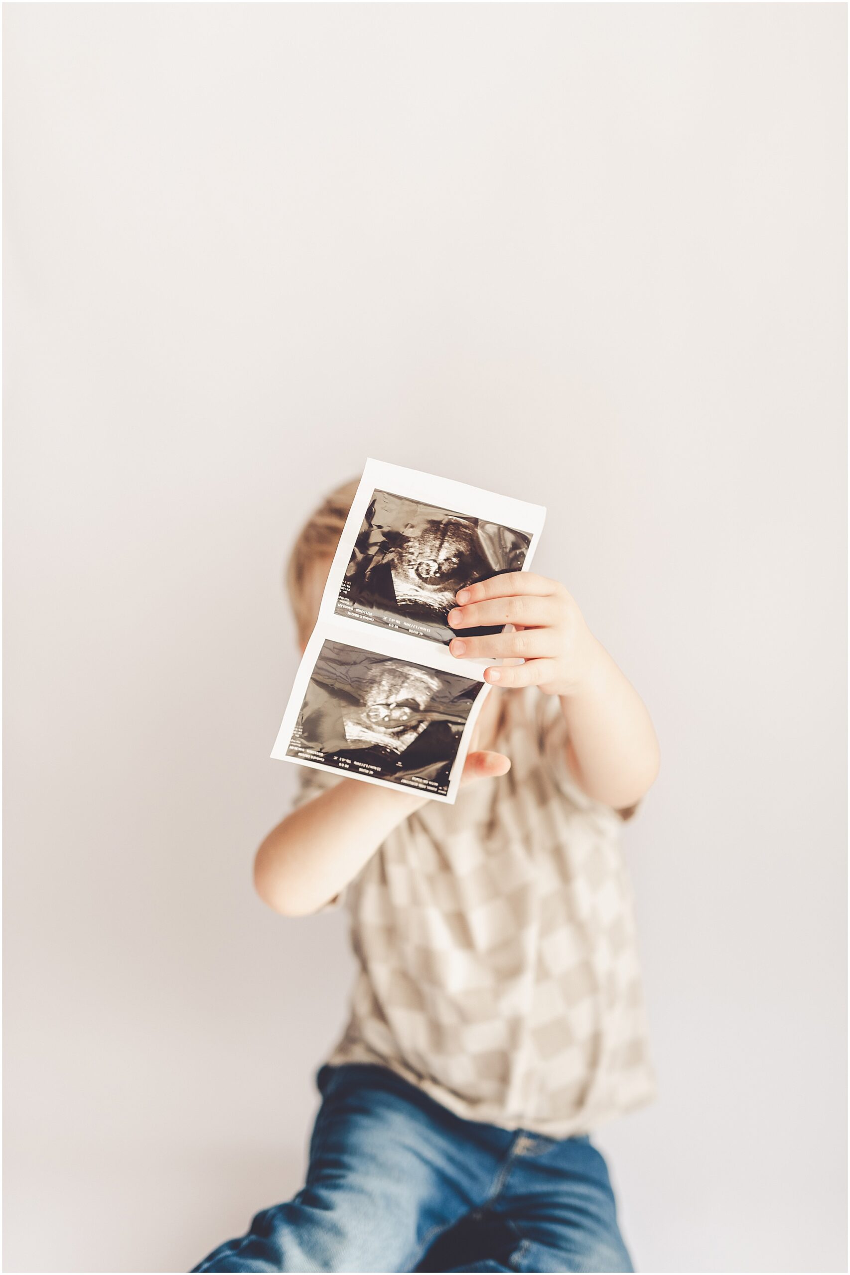 Studio pregnancy announcement family photo ideas with Kankakee family photographer Kara Evans Photographer.