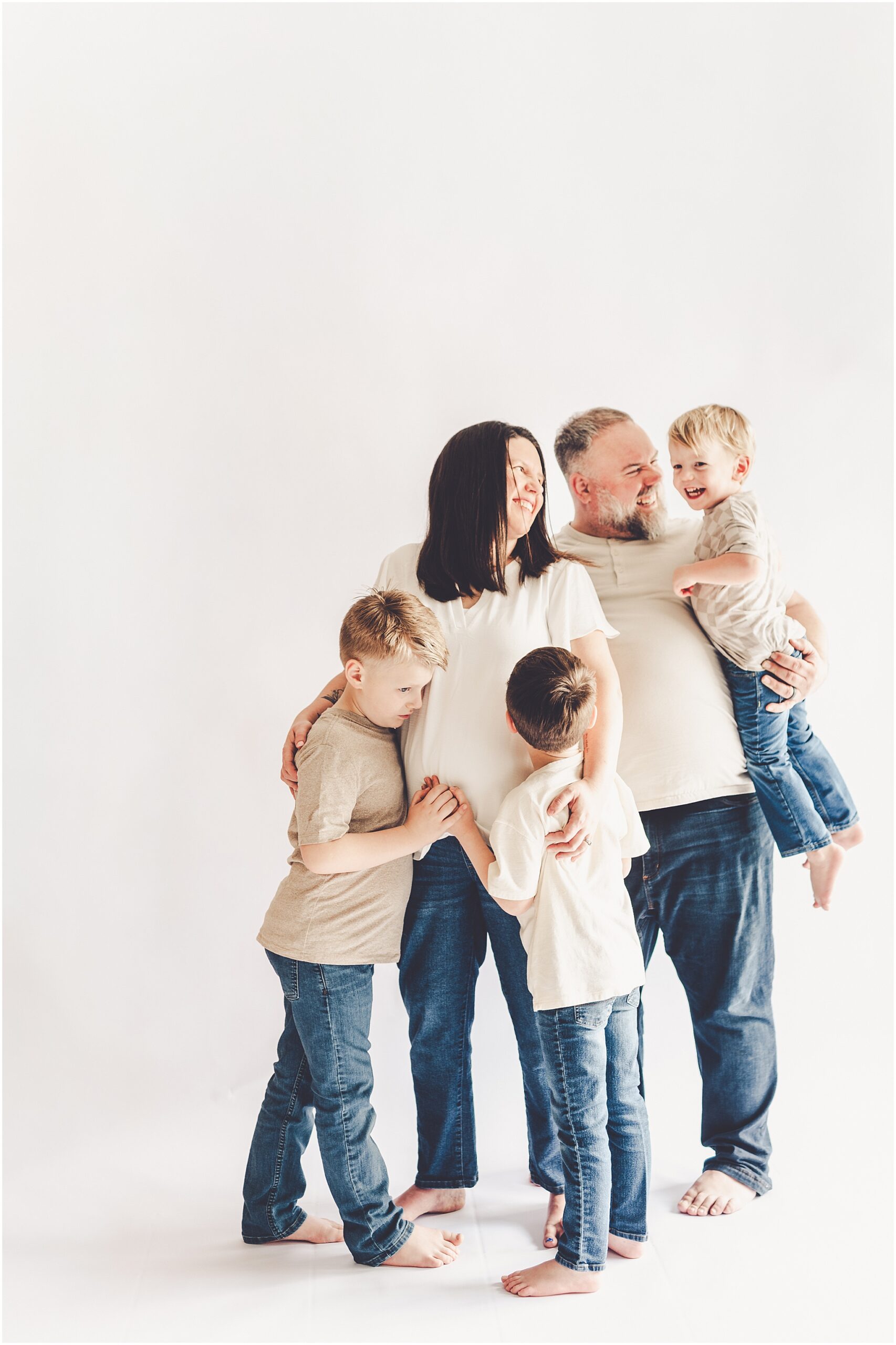 Studio pregnancy announcement family photo ideas with Kankakee family photographer Kara Evans Photographer.