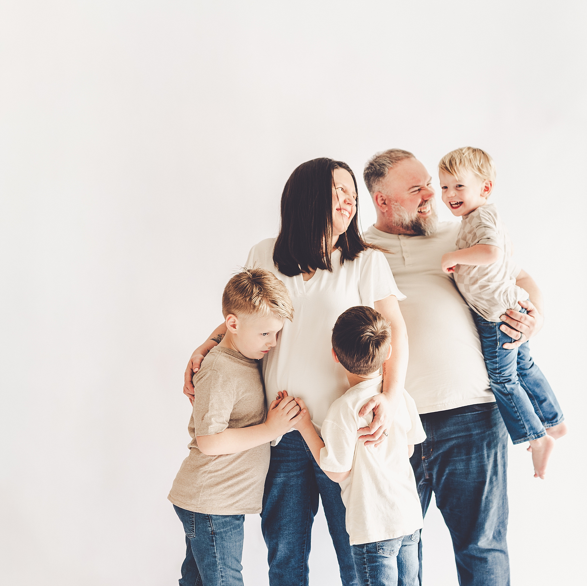 Studio pregnancy announcement family photo ideas with Kankakee family photographer Kara Evans Photographer.