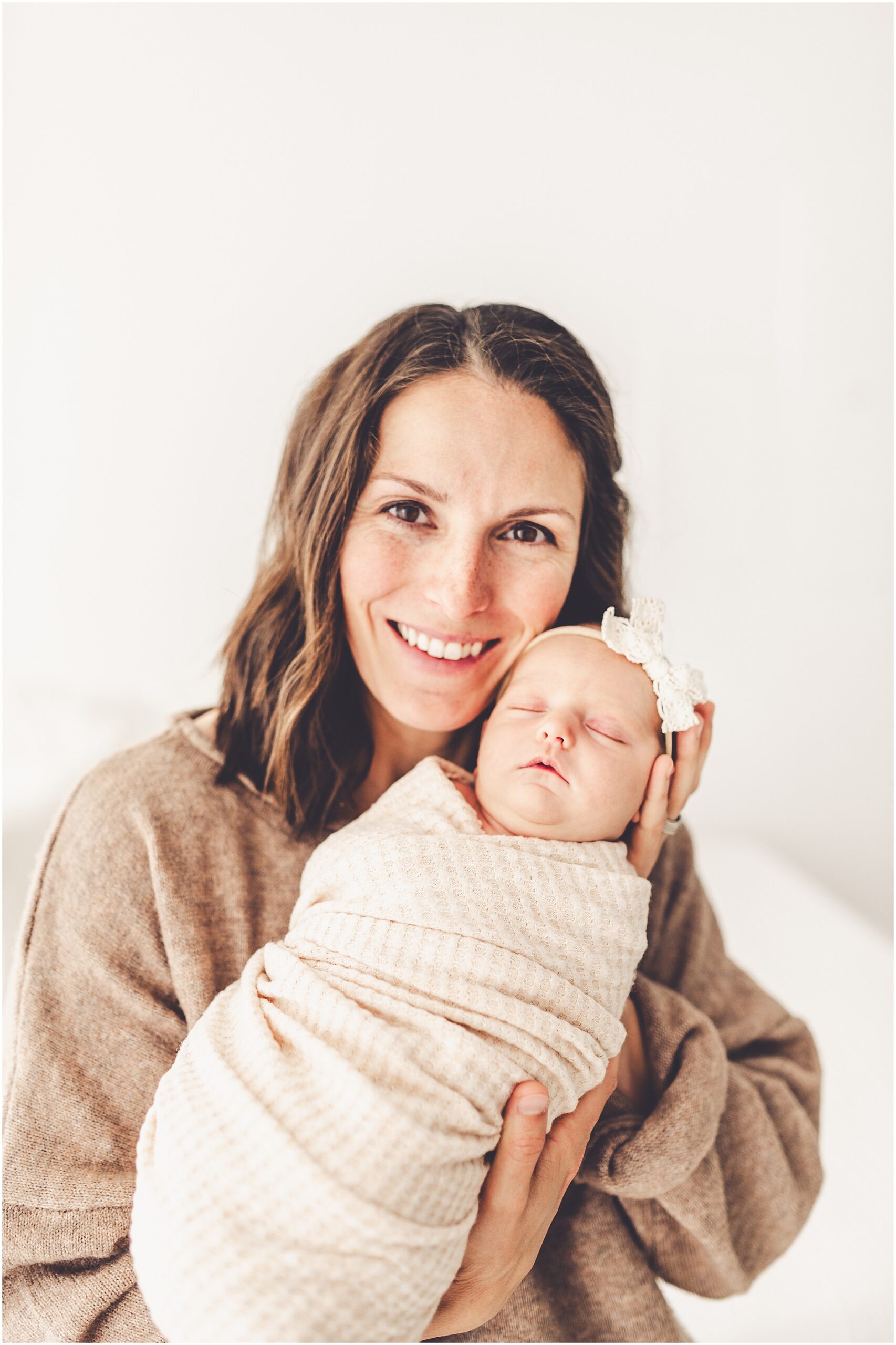 Kara Evans Photographer offers a Kankakee studio newborn session experience focused on beautifully documenting your growing family.