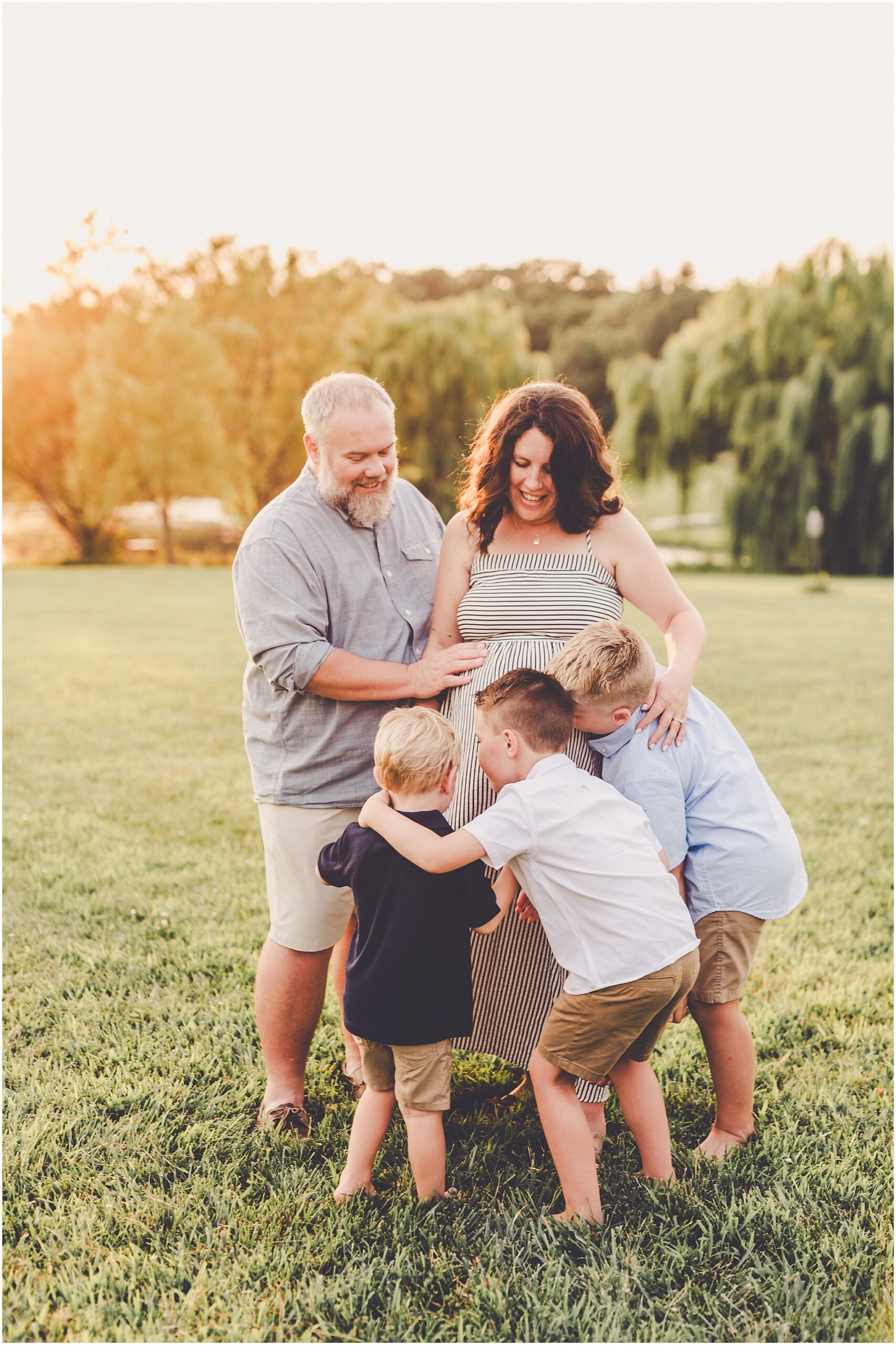 A Central Illinois summer family session with the Evans family filled with golden sunset light, backyard adventures, and genuine smiles.