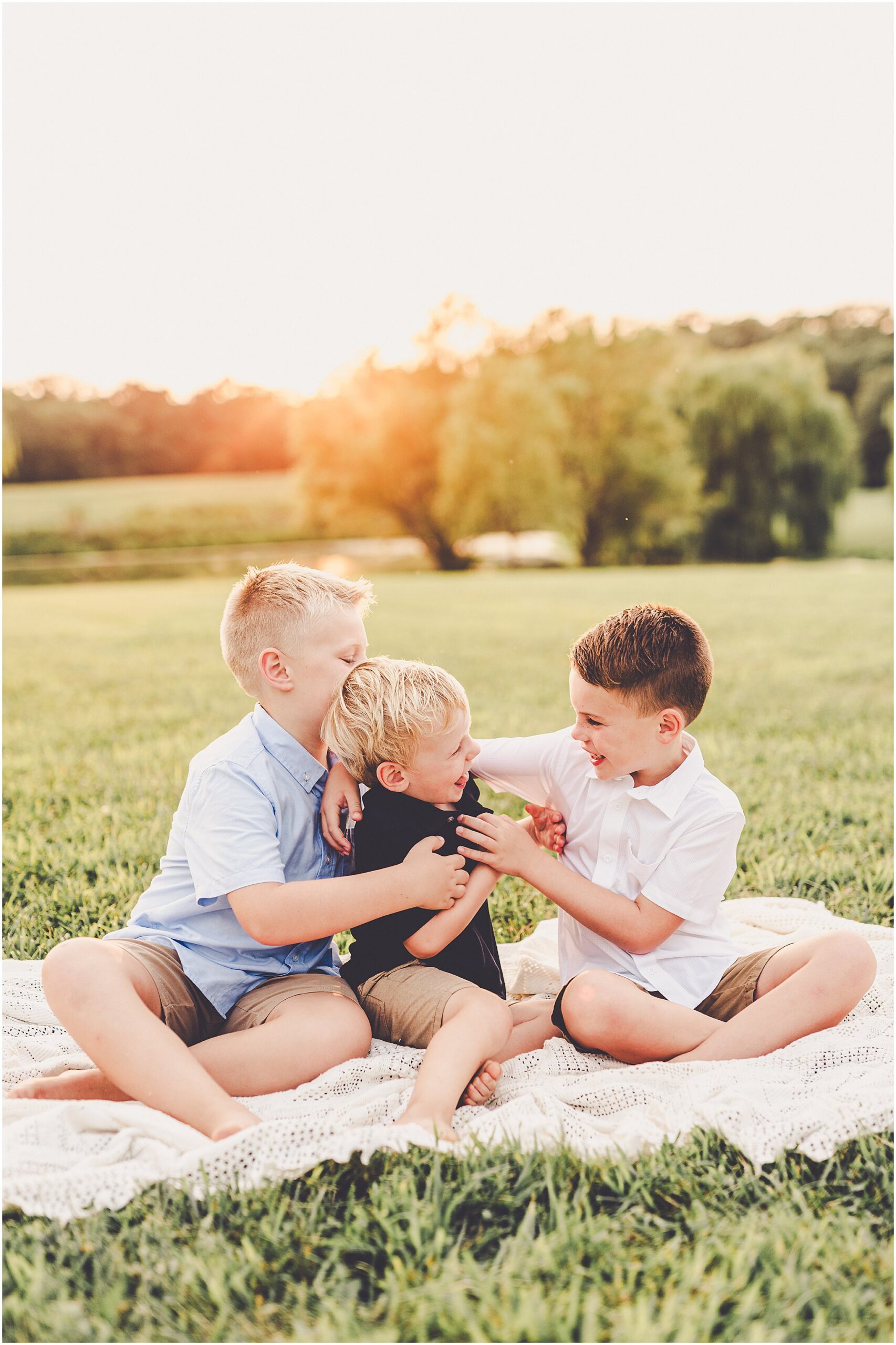 A Central Illinois summer family session with the Evans family filled with golden sunset light, backyard adventures, and genuine smiles.