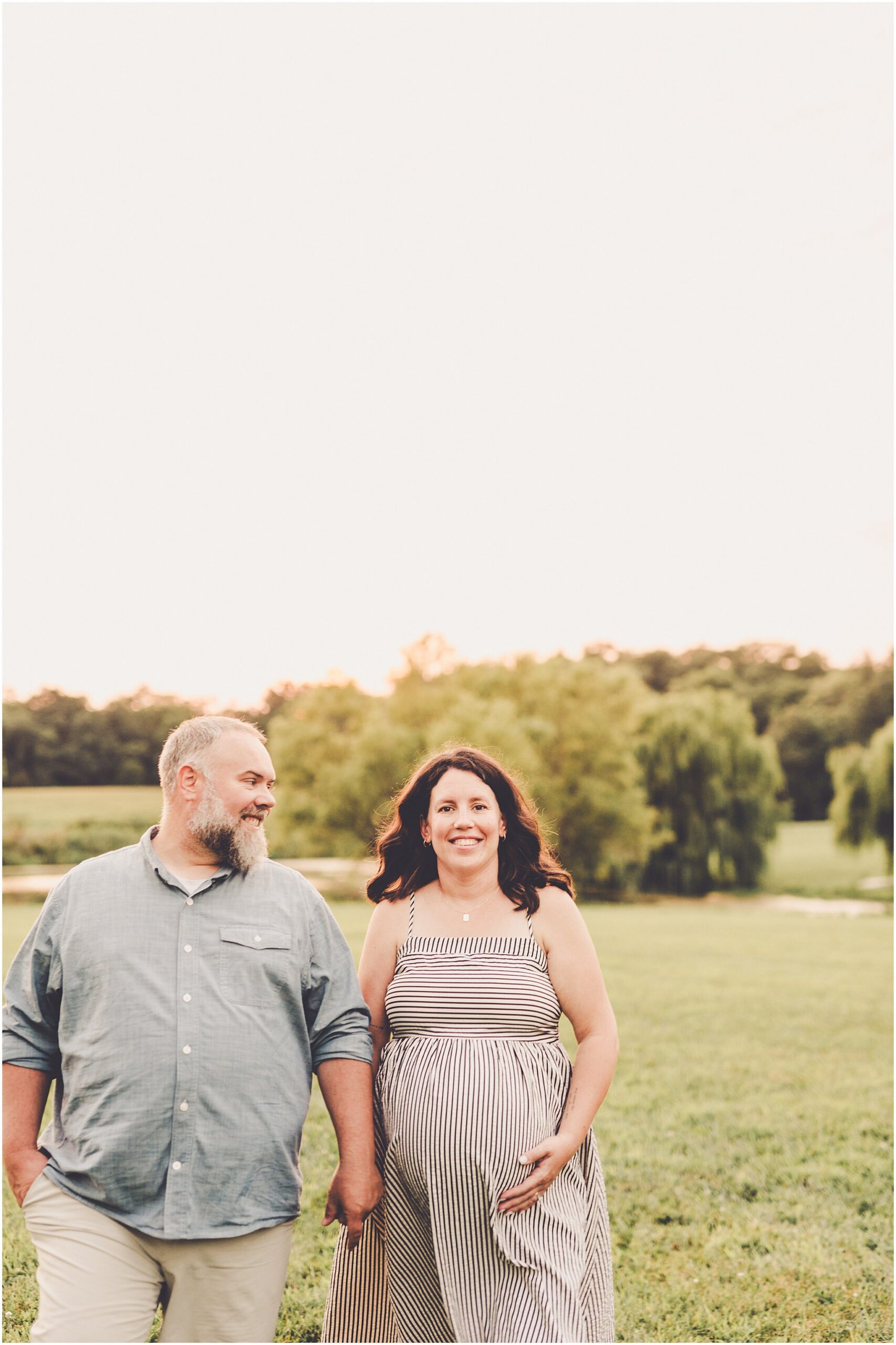 A Central Illinois summer family session with the Evans family filled with golden sunset light, backyard adventures, and genuine smiles.