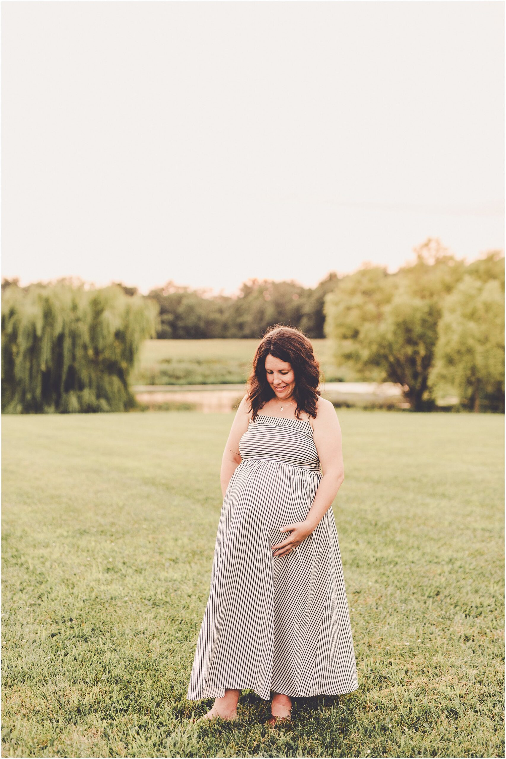 A Central Illinois summer family session with the Evans family filled with golden sunset light, backyard adventures, and genuine smiles.