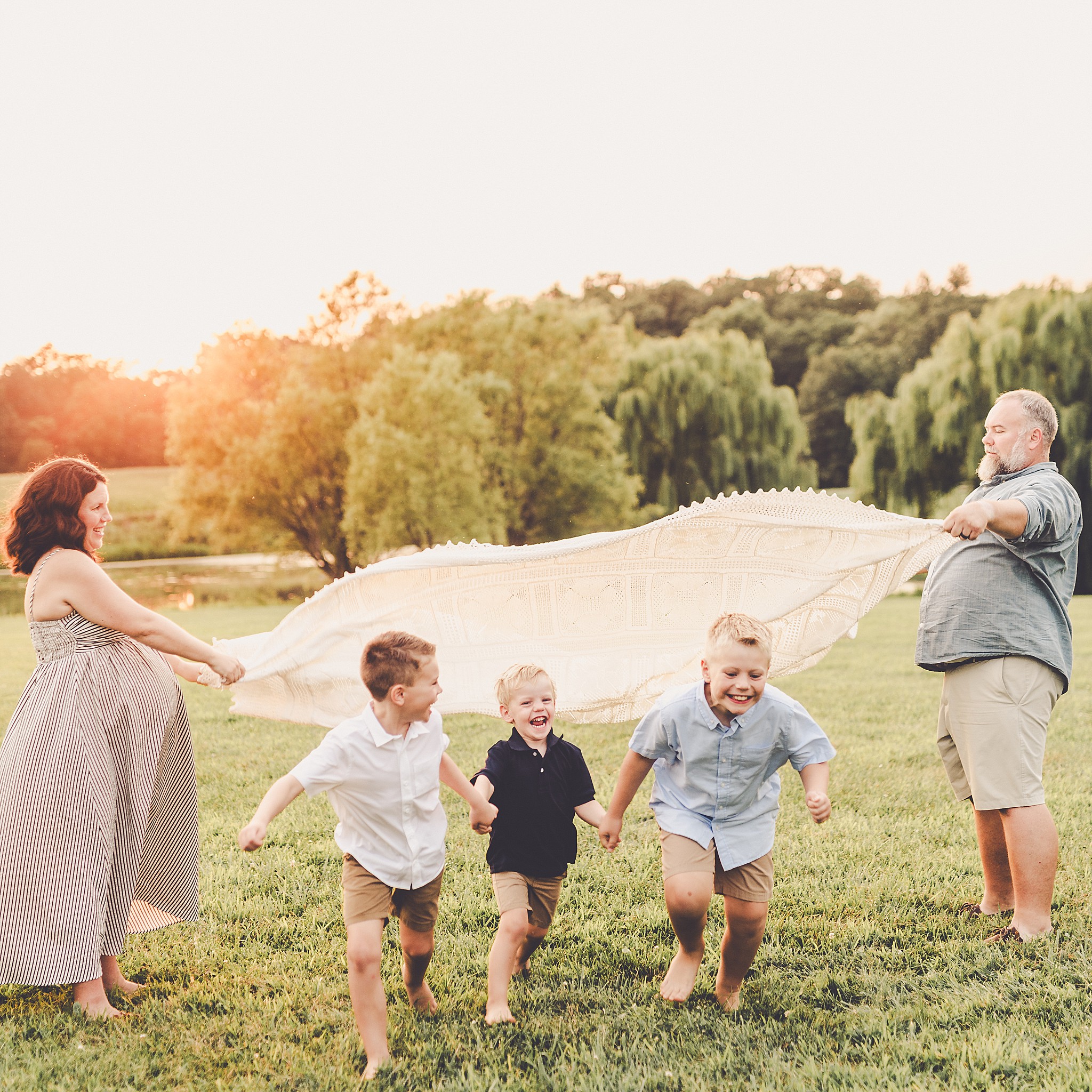 A Central Illinois summer family session with the Evans family filled with golden sunset light, backyard adventures, and genuine smiles.