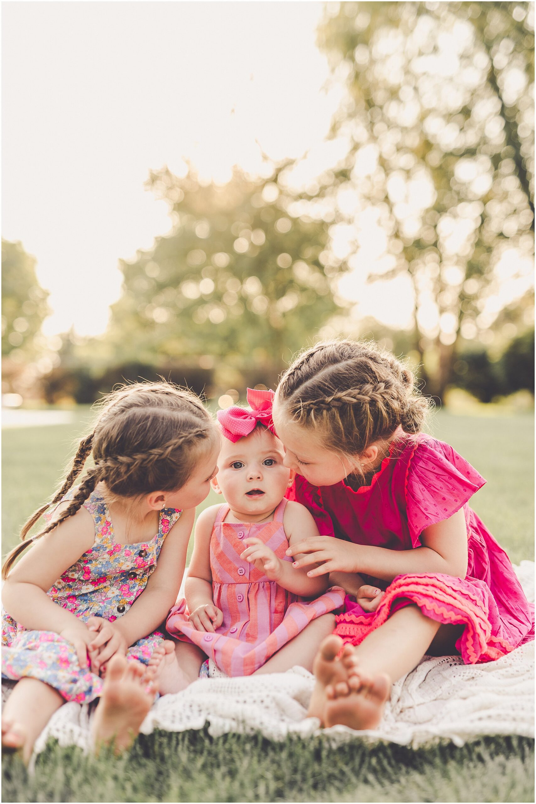 Celebrating baby Kambry's eight-month milestone with a playful, pink-filled summer backyard session in Kankakee County.