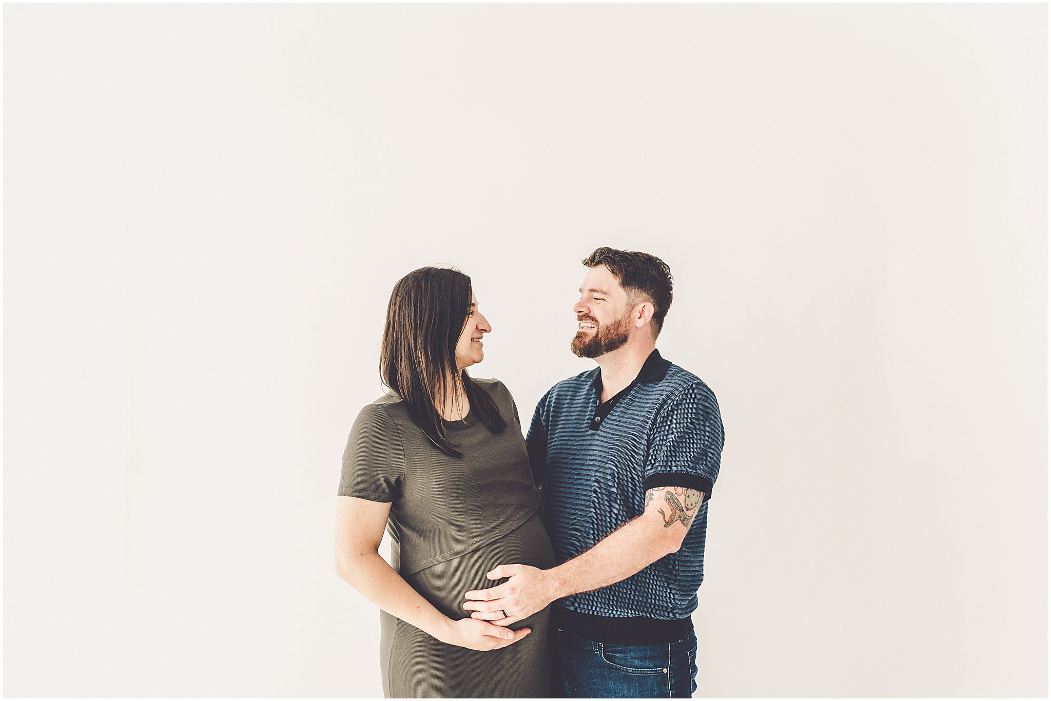 Michelle and Derek celebrate their growing family with a simple and sweet studio maternity session at Studio 388 in downtown Kankakee, Illinois.