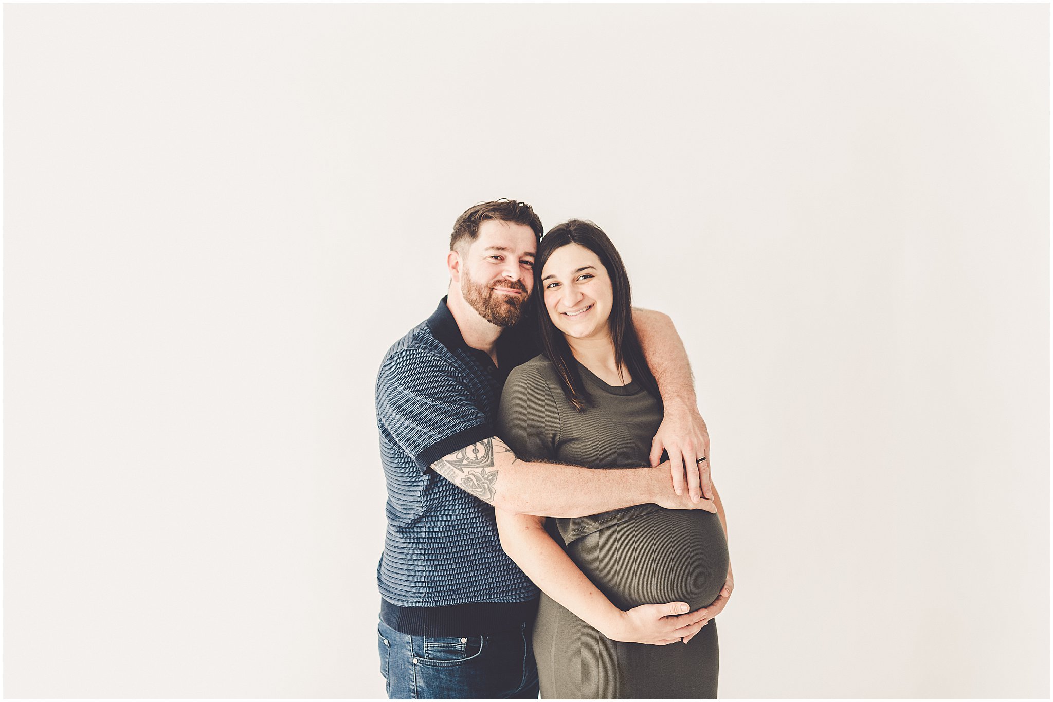 Michelle and Derek celebrate their growing family with a simple and sweet studio maternity session at Studio 388 in downtown Kankakee, Illinois.