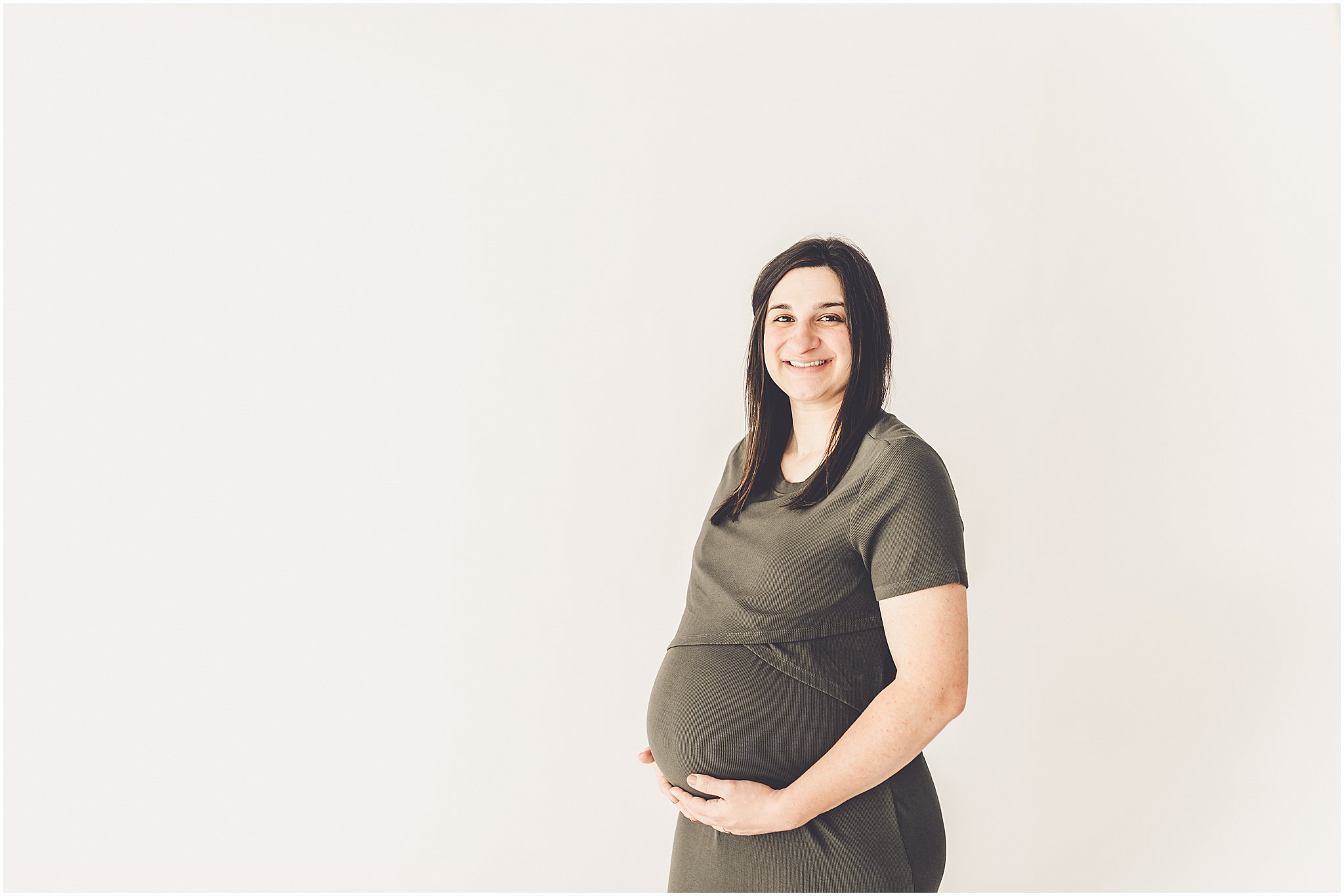 Michelle and Derek celebrate their growing family with a simple and sweet studio maternity session at Studio 388 in downtown Kankakee, Illinois.