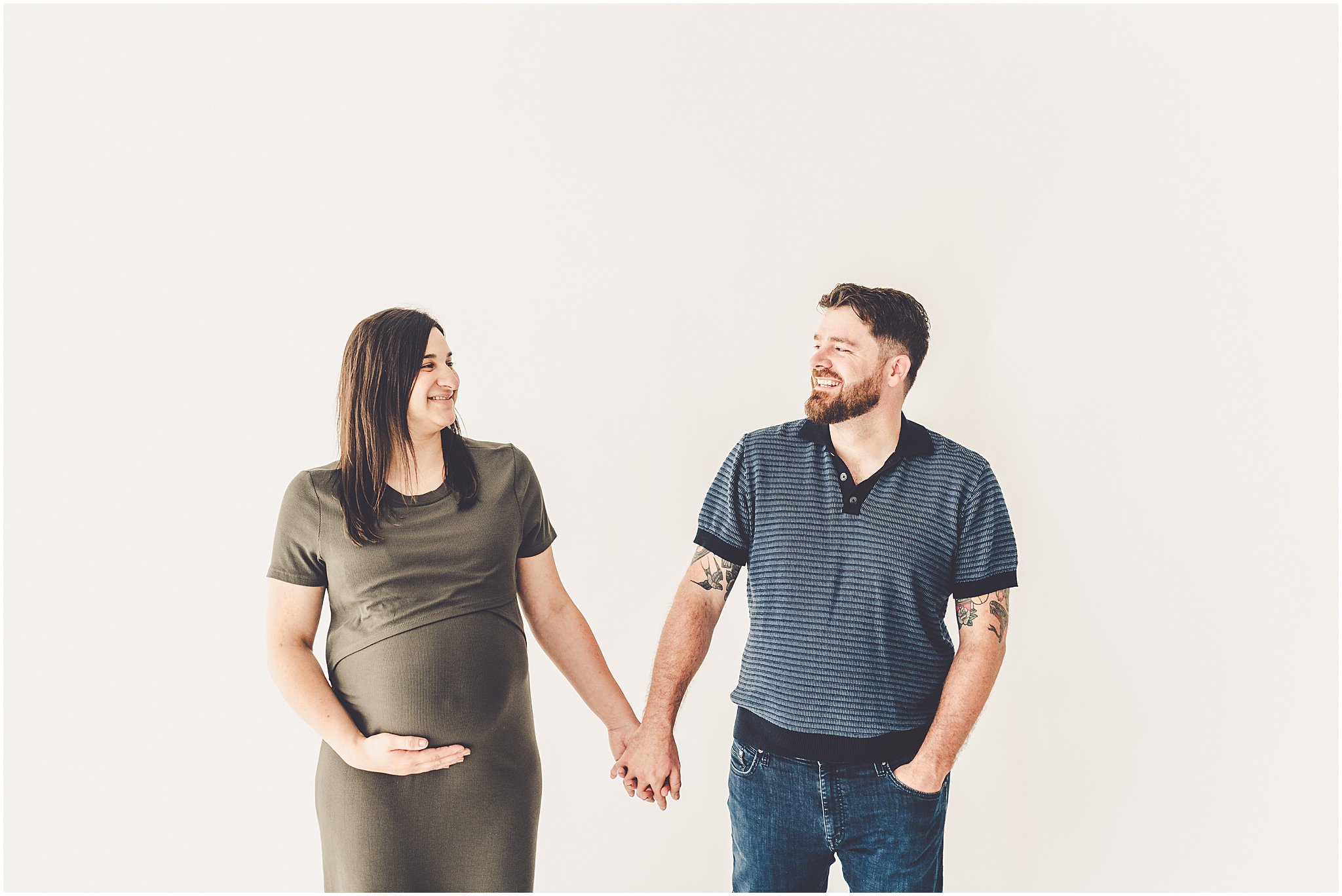 Michelle and Derek celebrate their growing family with a simple and sweet studio maternity session at Studio 388 in downtown Kankakee, Illinois.