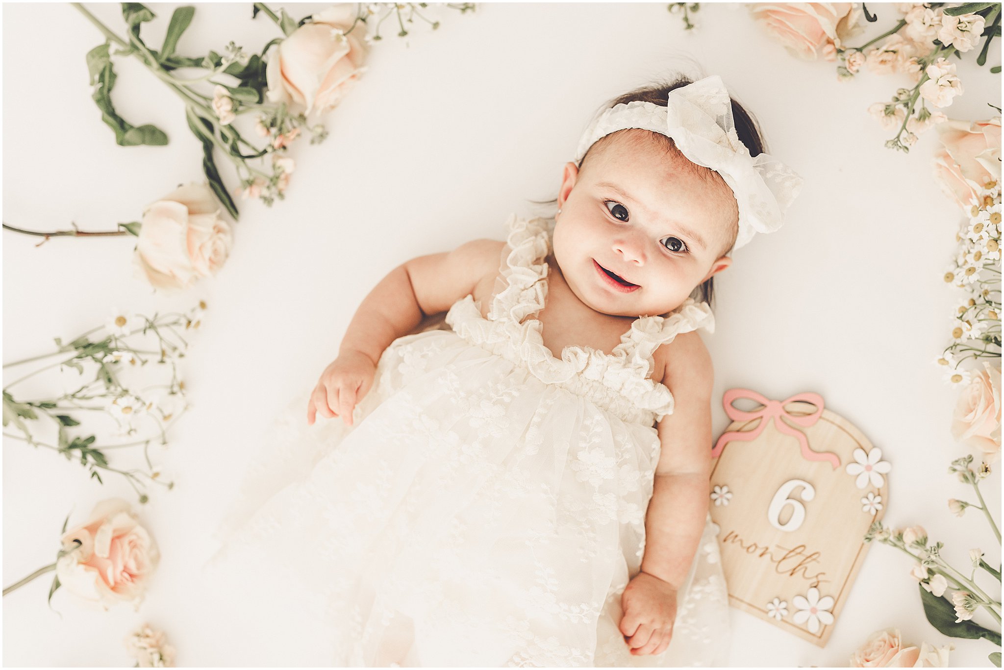 Kara Evans Photographer is a studio milestone photographer based in Kankakee at the natural light photography studio, Studio 388.