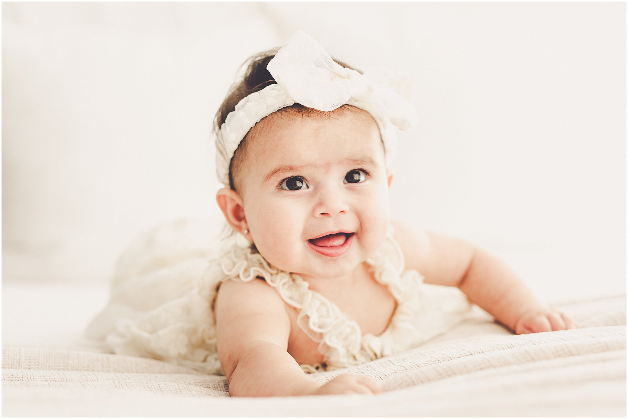 Kara Evans Photographer is a studio milestone photographer based in Kankakee at the natural light photography studio, Studio 388.
