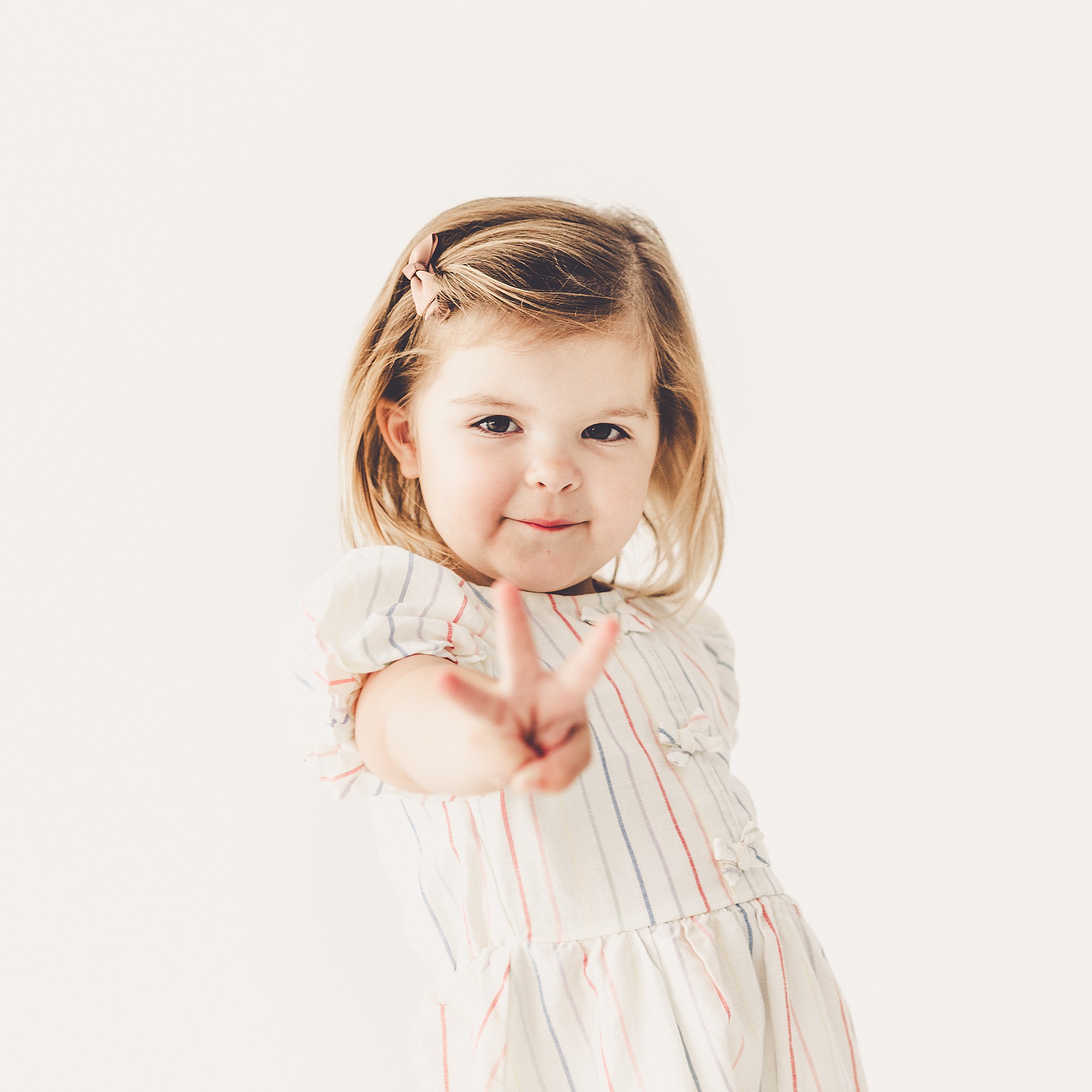 Inspiration for studio three-year milestone photos with Kankakee family and milestone photographer Kara Evans Photographer.