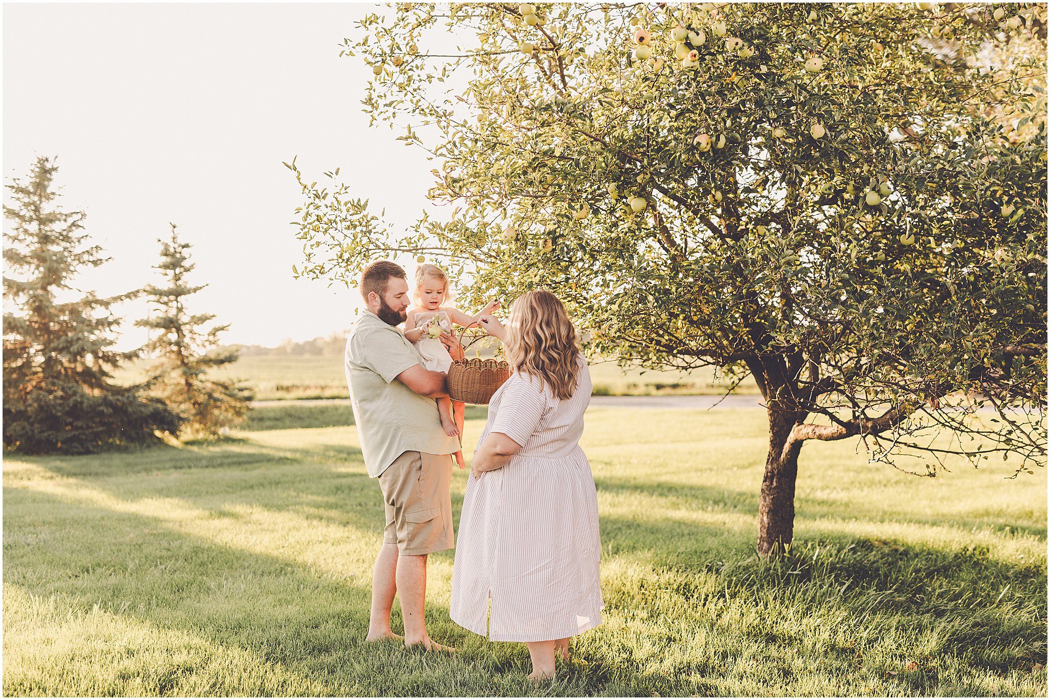 A summer backyard sunset session with the Cowsert family photographed by Iroquois County family photographer Kara Evans Photographer.