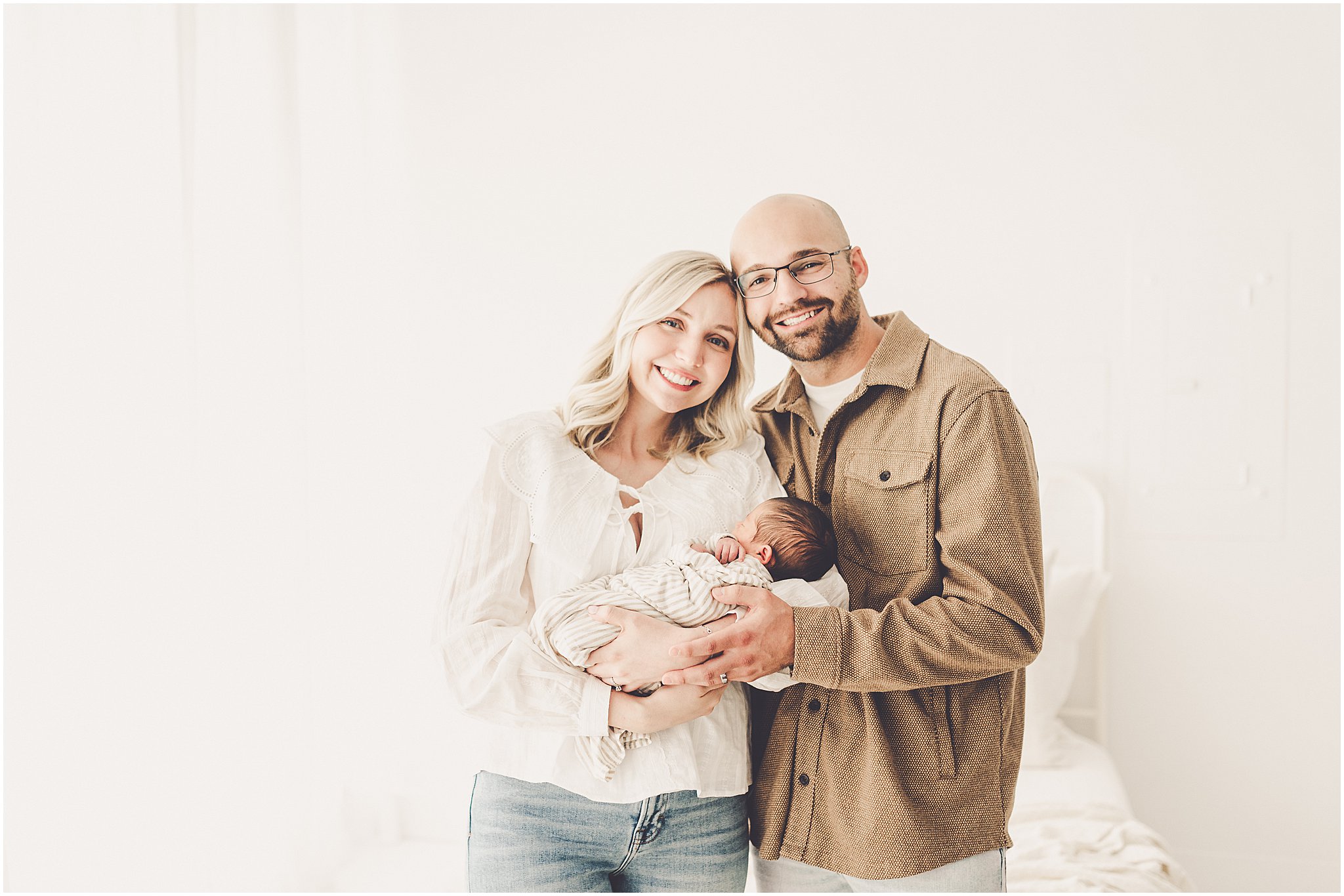 A sleeply, snuggly newborn baby in the Kankakee studio with Kankakee family & newborn photographer Kara Evans Photographer.