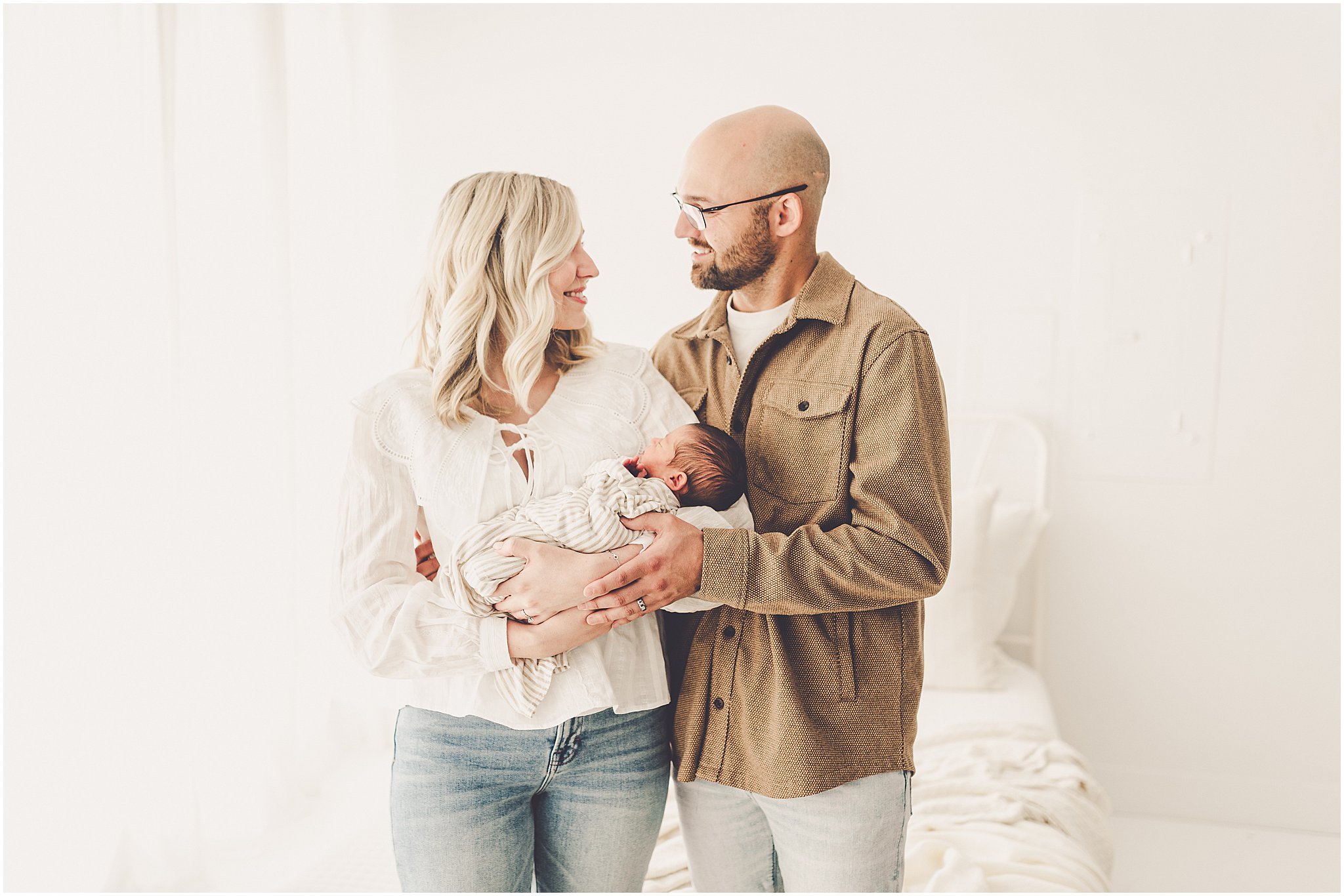 A sleeply, snuggly newborn baby in the Kankakee studio with Kankakee family & newborn photographer Kara Evans Photographer.