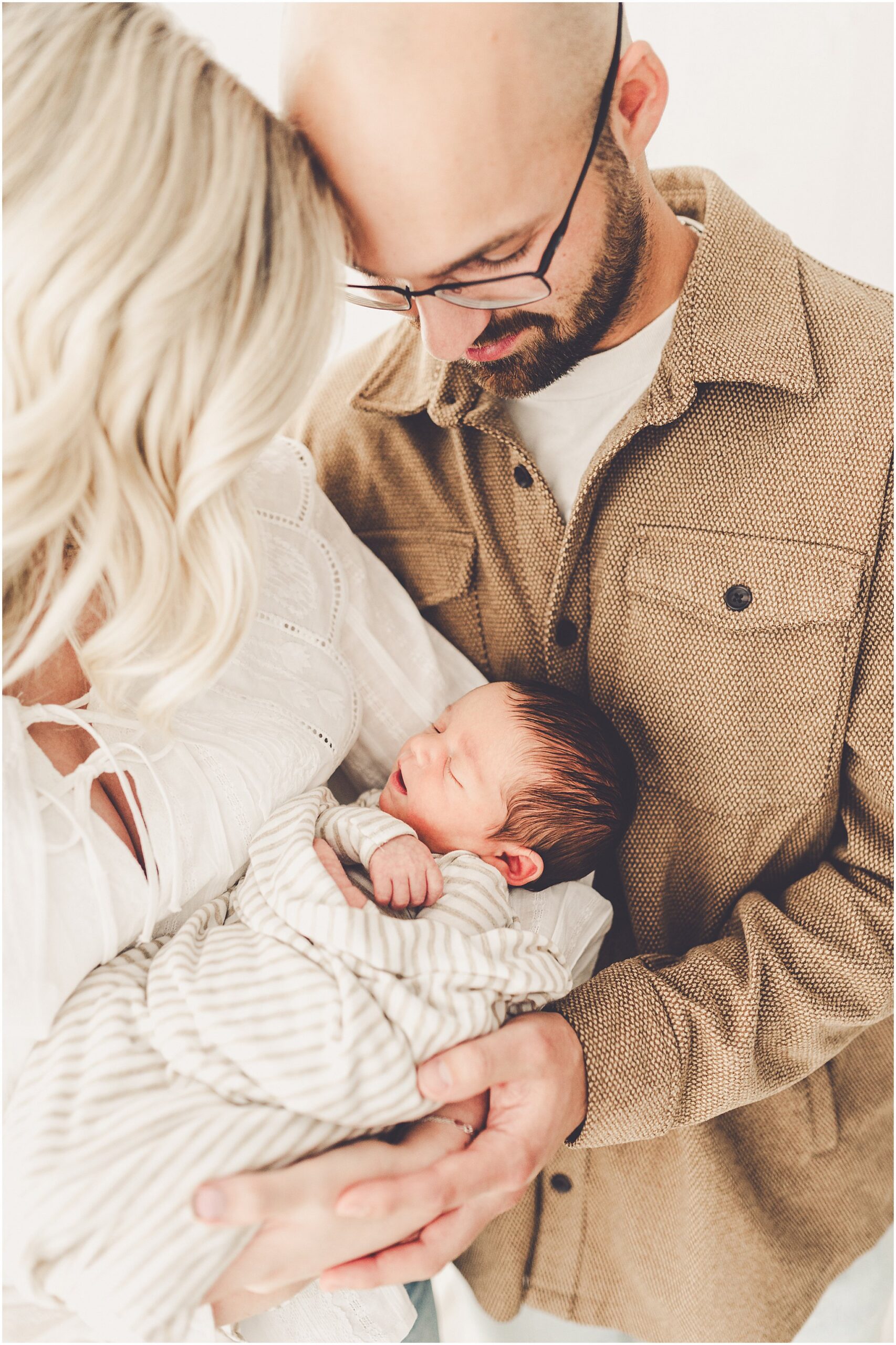 A sleeply, snuggly newborn baby in the Kankakee studio with Kankakee family & newborn photographer Kara Evans Photographer.
