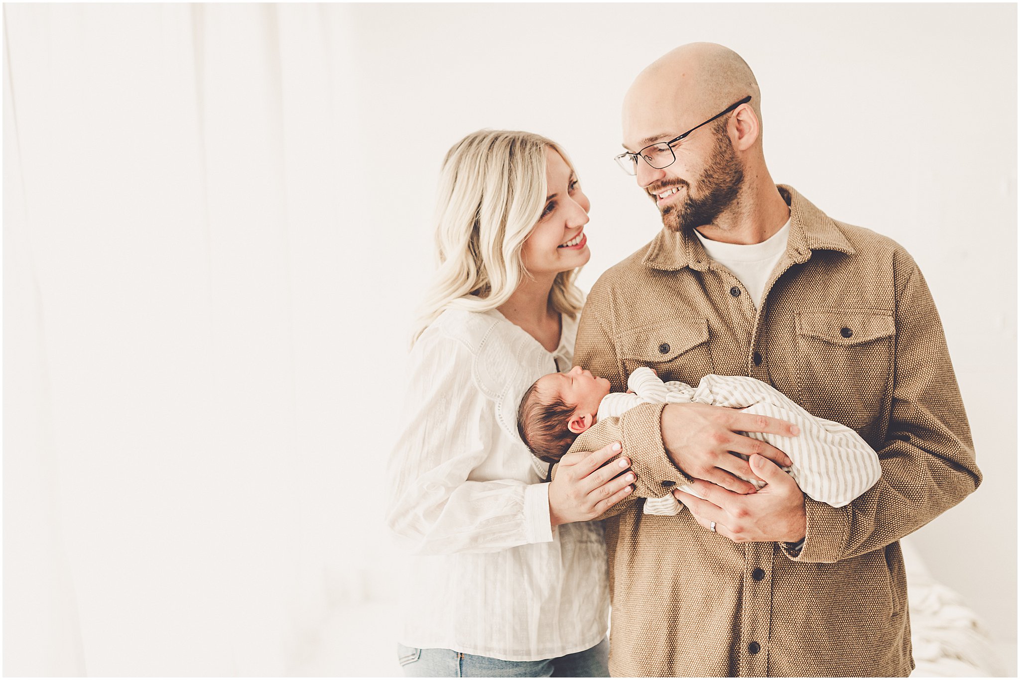 A sleeply, snuggly newborn baby in the Kankakee studio with Kankakee family & newborn photographer Kara Evans Photographer.