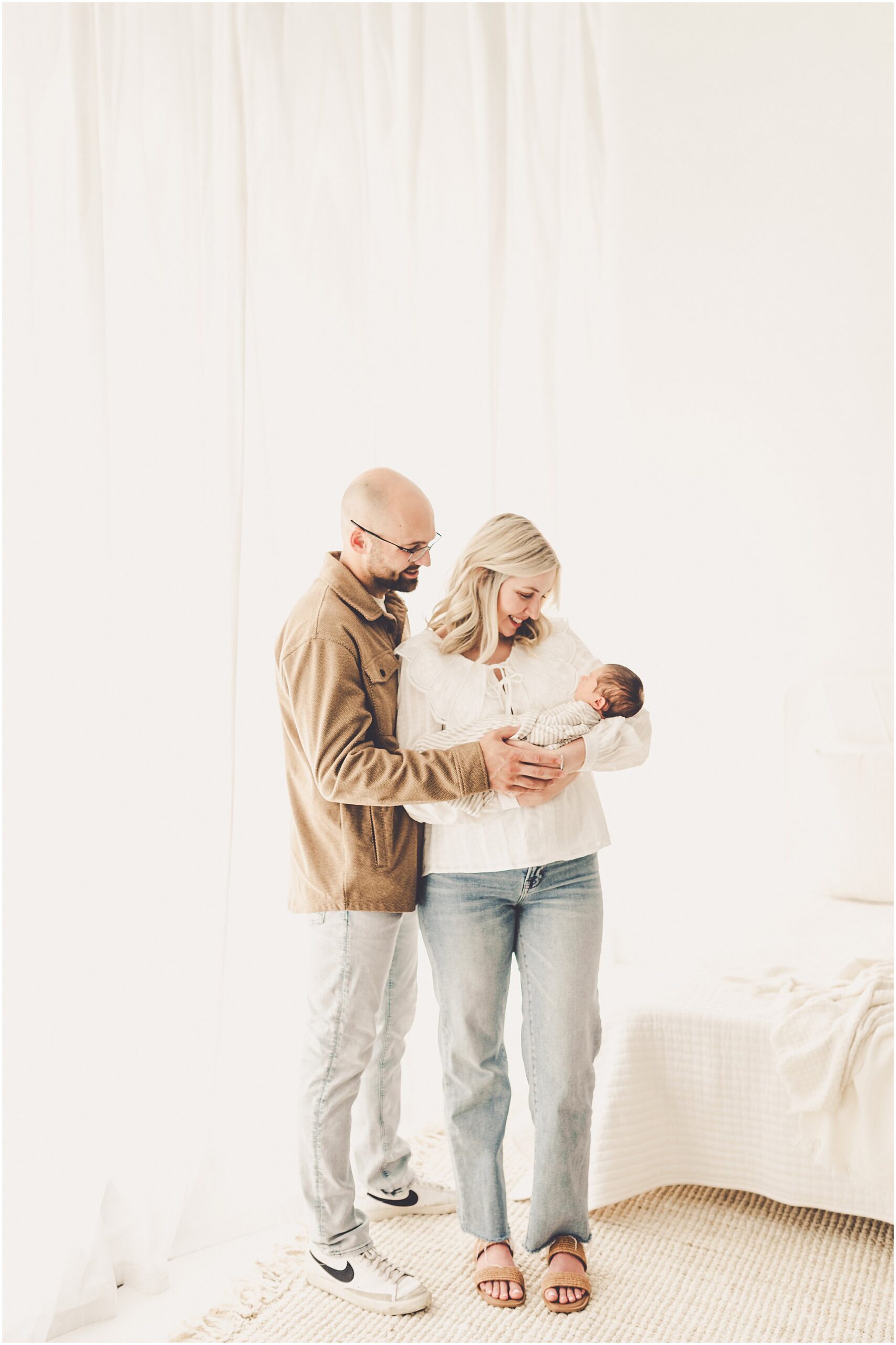 A sleeply, snuggly newborn baby in the Kankakee studio with Kankakee family & newborn photographer Kara Evans Photographer.