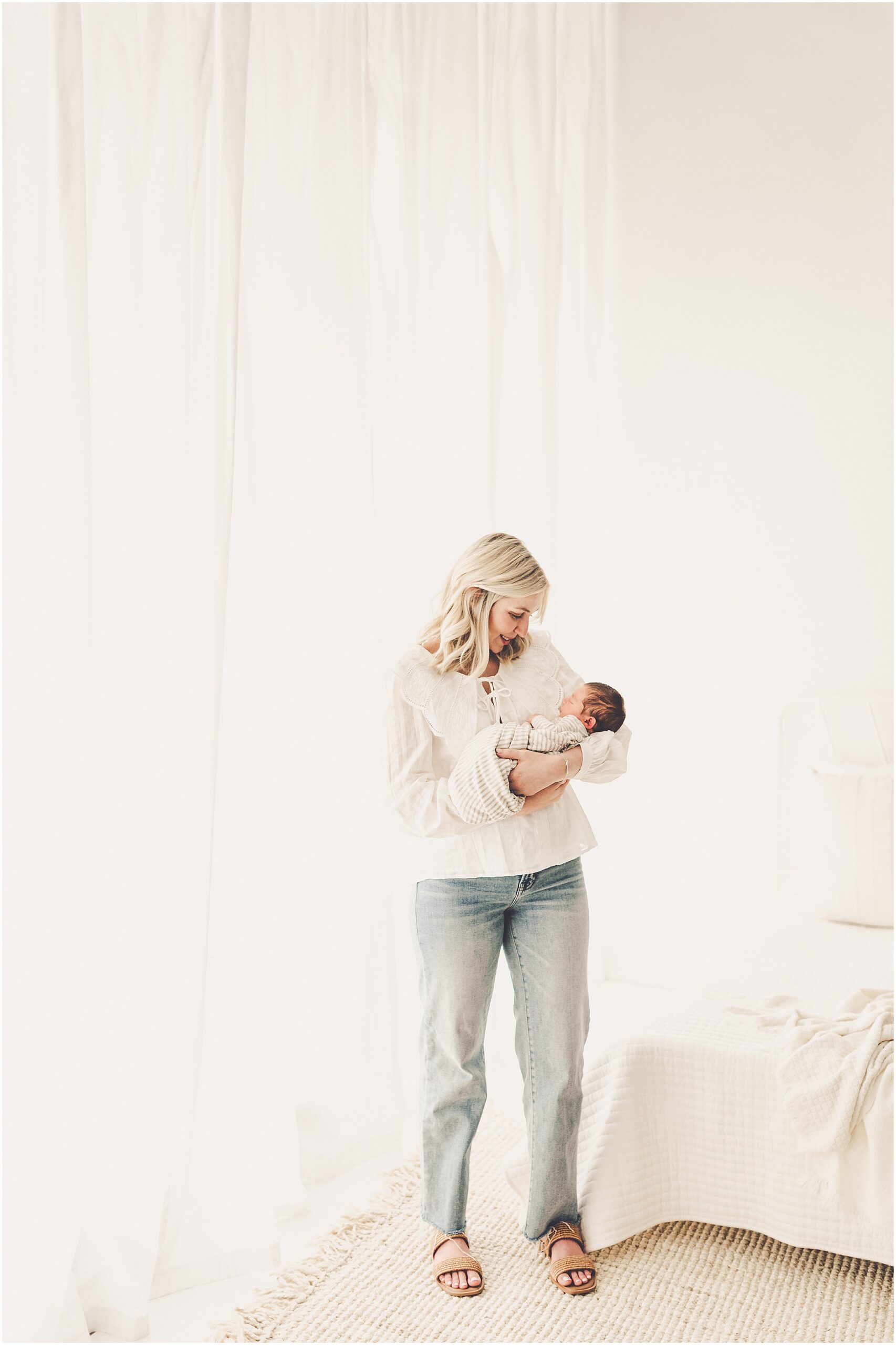 A sleeply, snuggly newborn baby in the Kankakee studio with Kankakee family & newborn photographer Kara Evans Photographer.