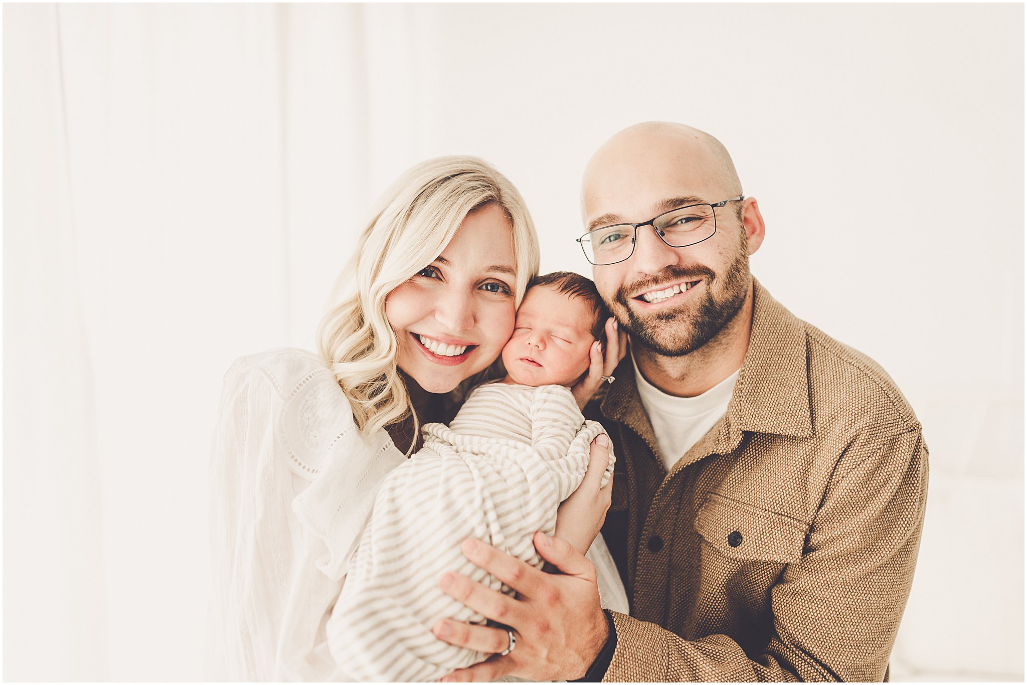 A sleeply, snuggly newborn baby in the Kankakee studio with Kankakee family & newborn photographer Kara Evans Photographer.