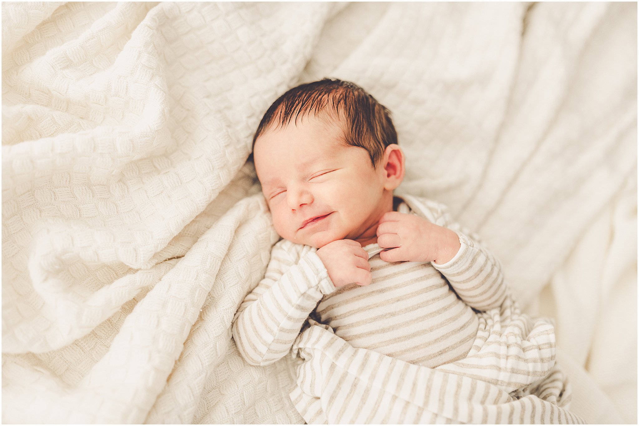 A sleeply, snuggly newborn baby in the Kankakee studio with Kankakee family & newborn photographer Kara Evans Photographer.