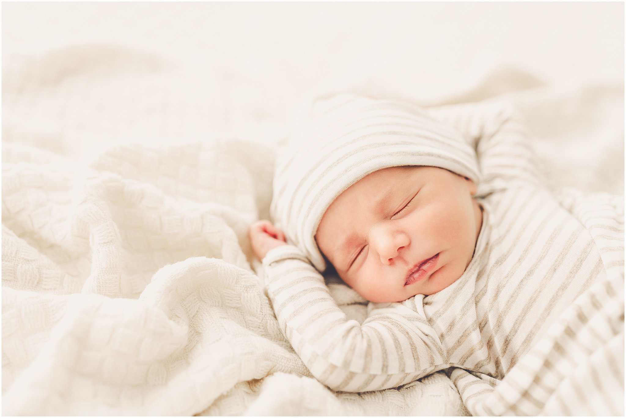 A sleeply, snuggly newborn baby in the Kankakee studio with Kankakee family & newborn photographer Kara Evans Photographer.