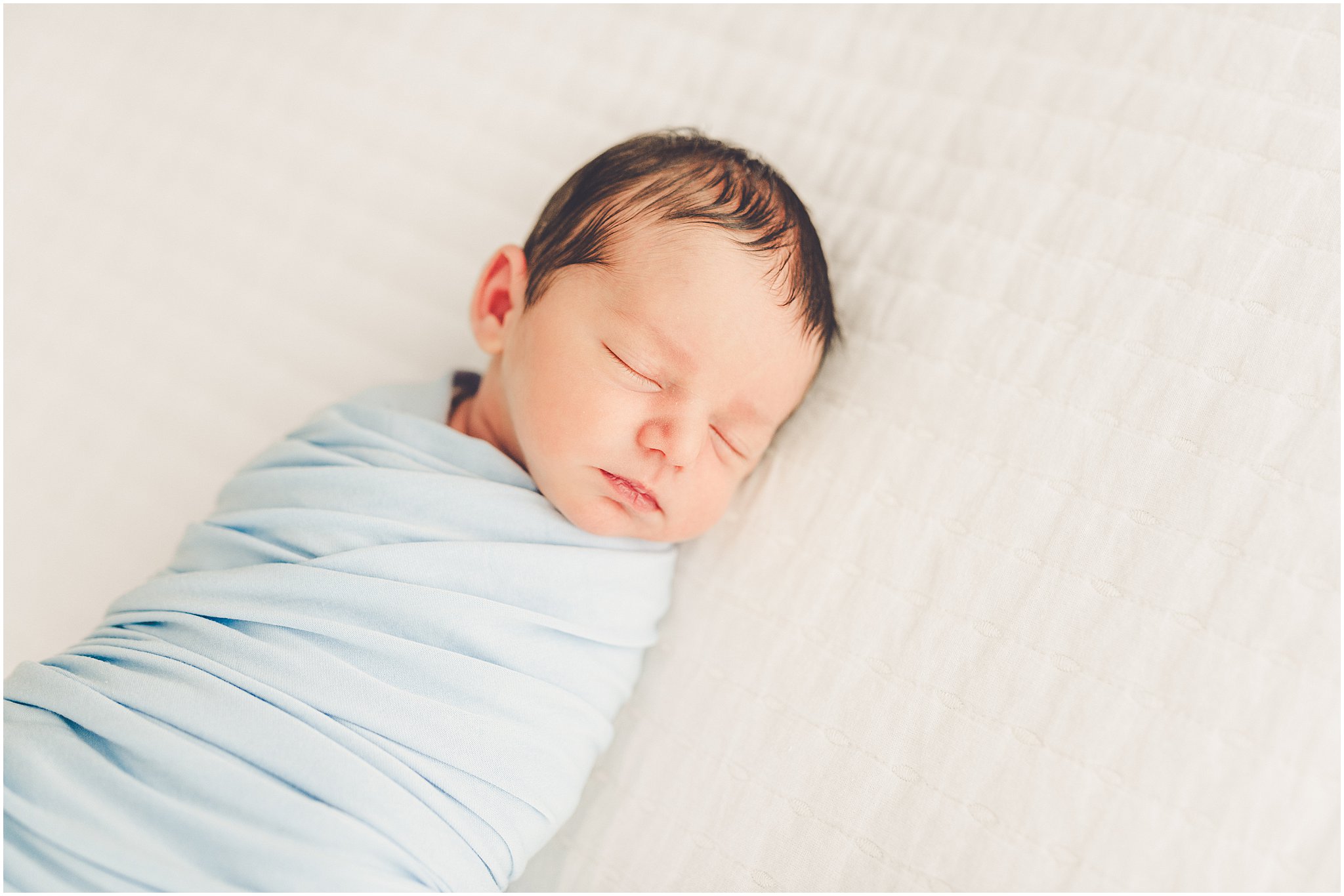 A sleeply, snuggly newborn baby in the Kankakee studio with Kankakee family & newborn photographer Kara Evans Photographer.