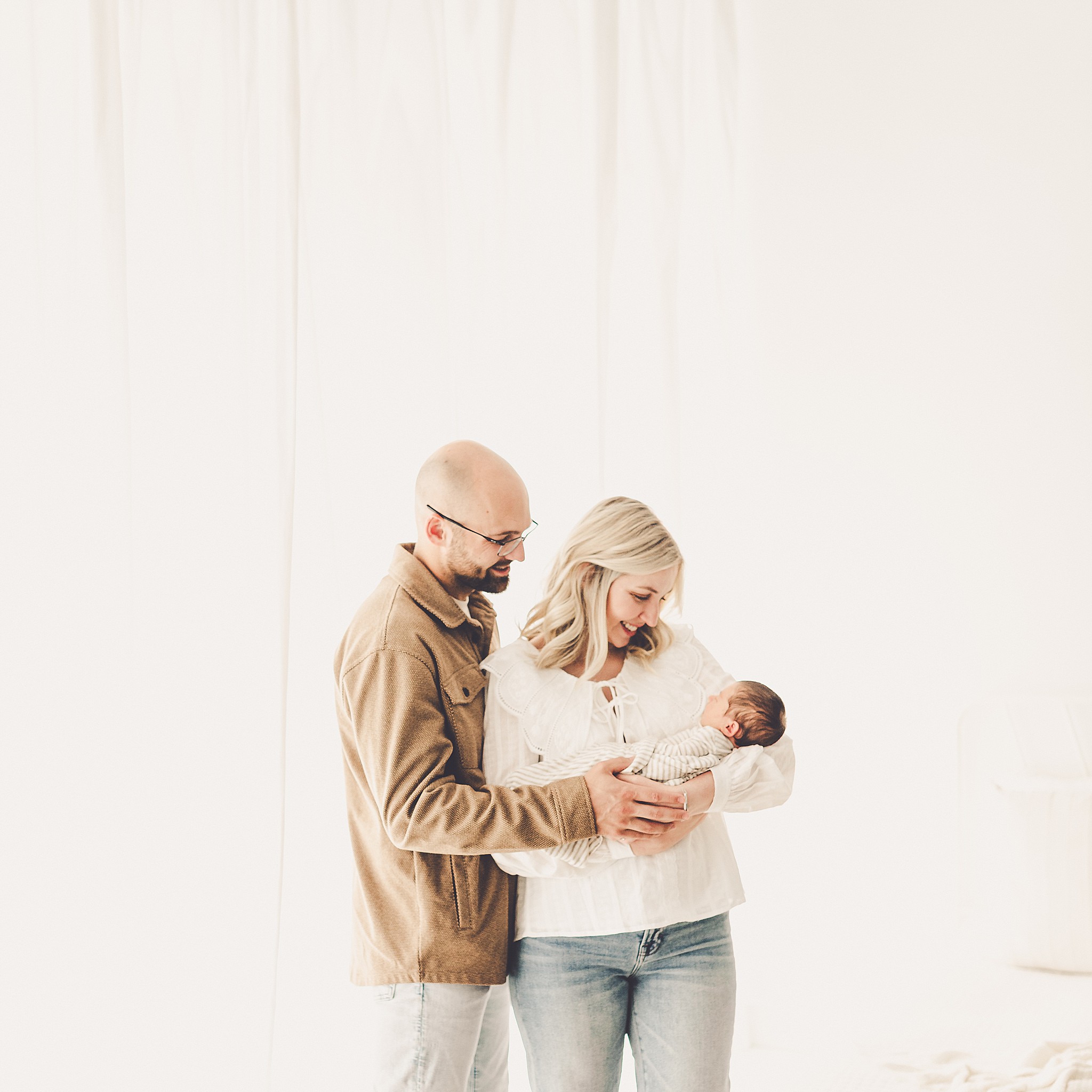 A sleeply, snuggly newborn baby in the Kankakee studio with Kankakee family & newborn photographer Kara Evans Photographer.