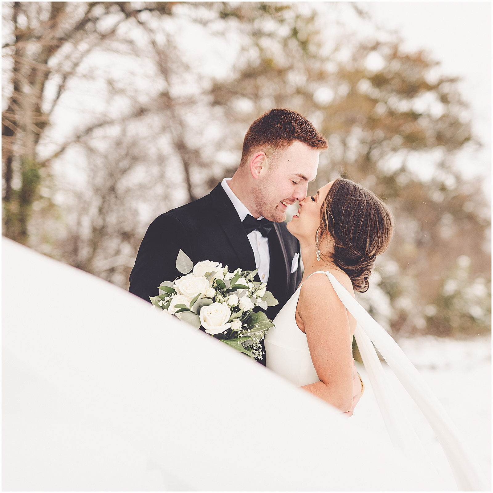 Kendall and Noah's snowy wedding day in St. Libory, Illinois with Chicagoland wedding photographer Kara Evans Photographer.